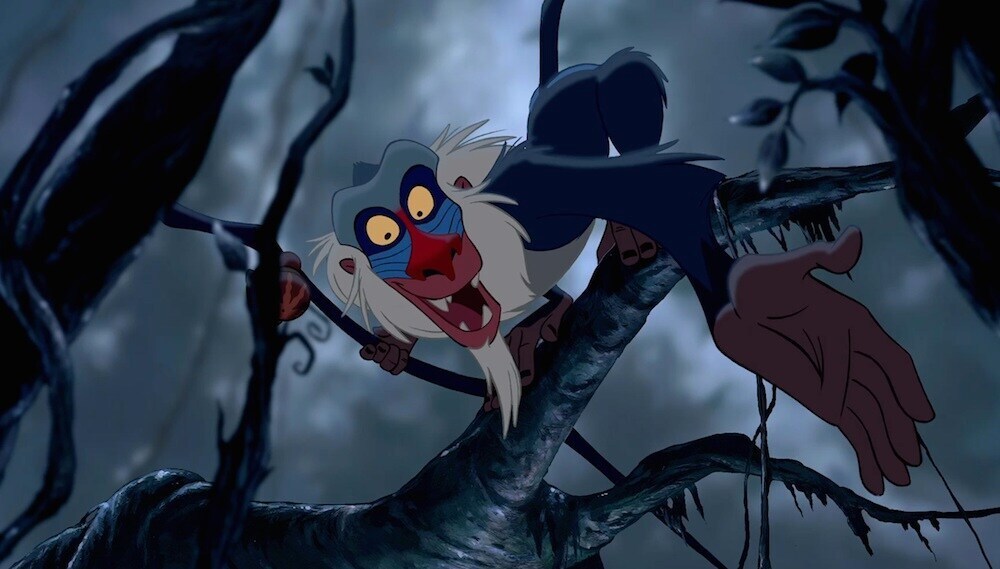 Rafiki, the baboon, in a tree in the movie "The Lion King"