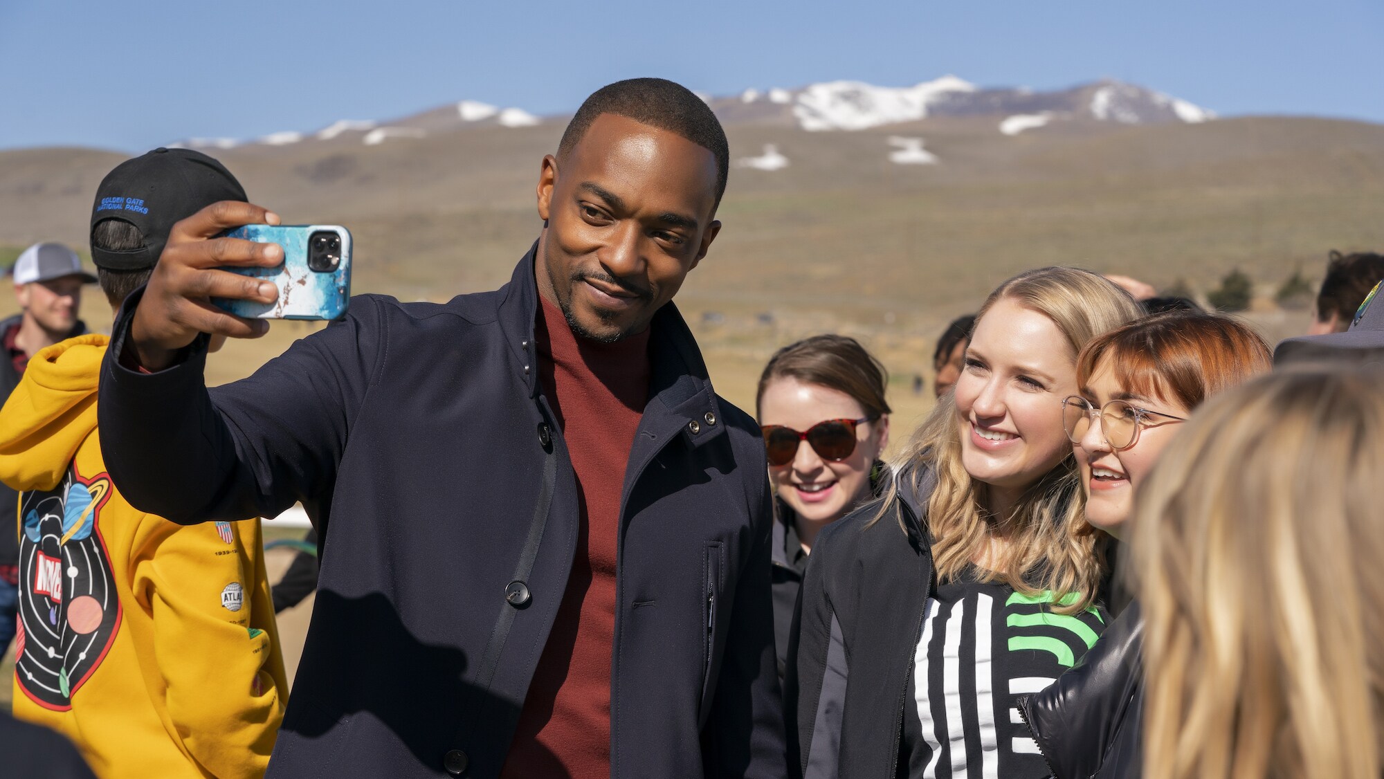 Anthony Mackie takes a selfie with fans as seen on Disney's RENNERVATIONS. (Disney/Katrina Marcinowski)