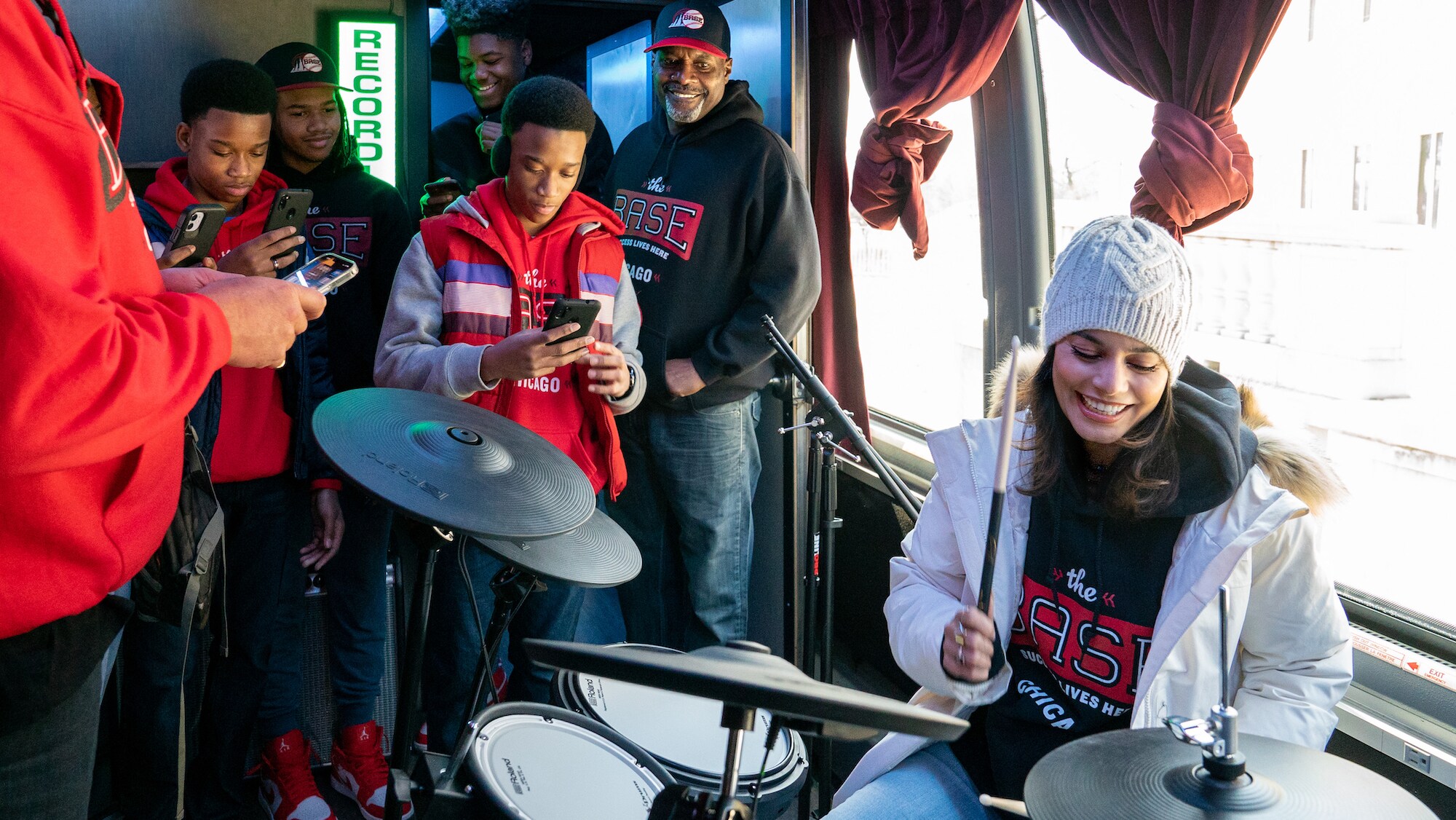 Vanessa Hudgens plays the drums inside the final The BASE Chicago vehicle on Disney's RENNERVATIONS. (Disney/Jean Whiteside)