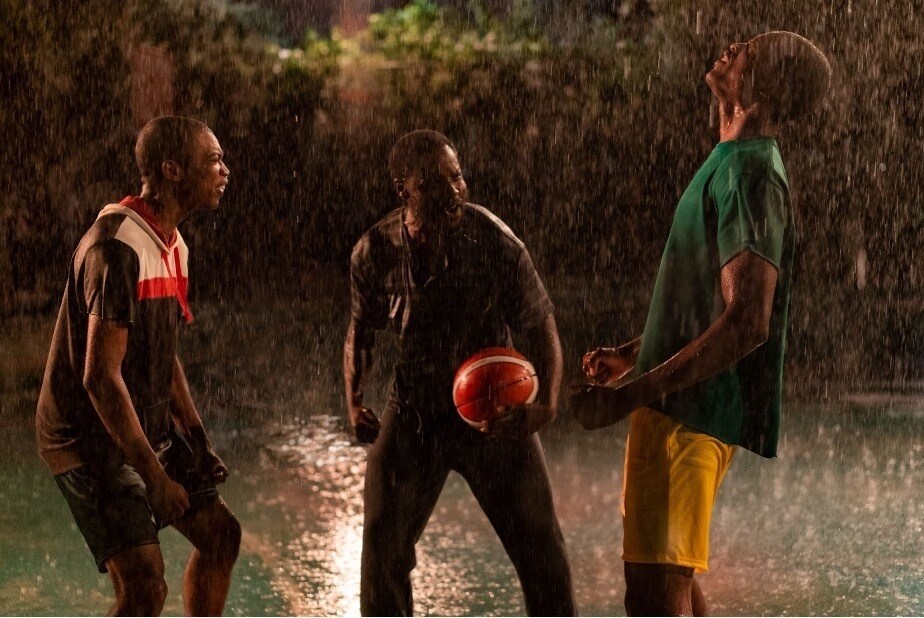 The boys play basketball with their father in the rain in the Disney+ Original Rise