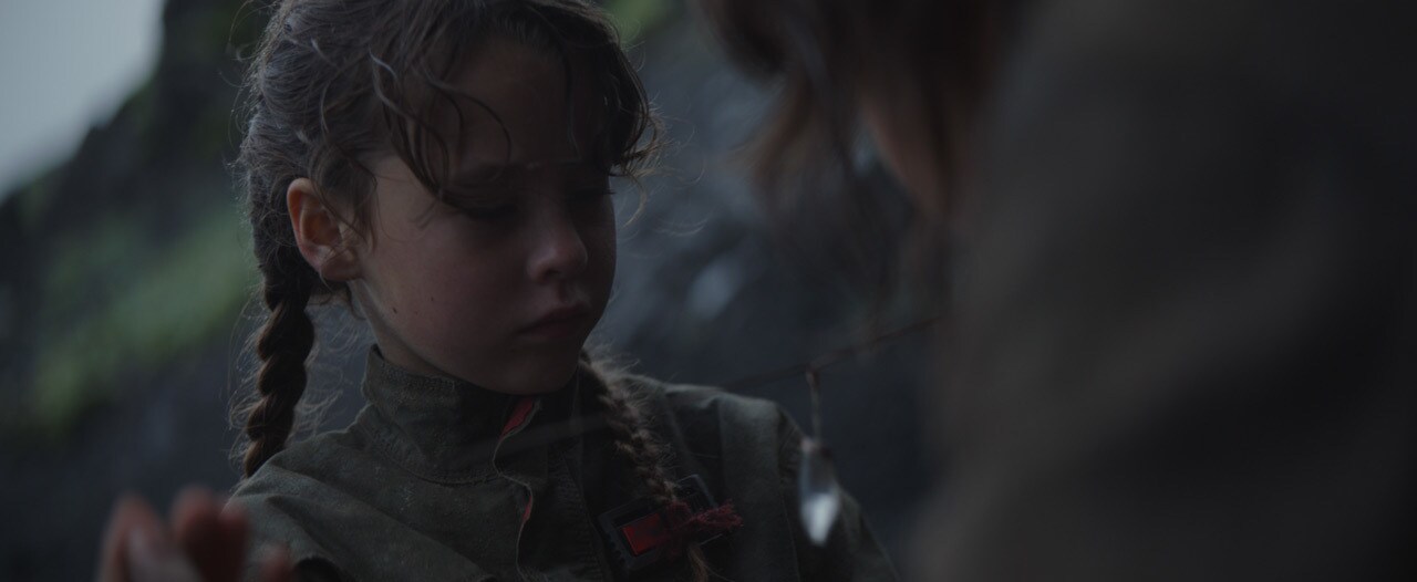 Jyn escapes as her family is attacked.