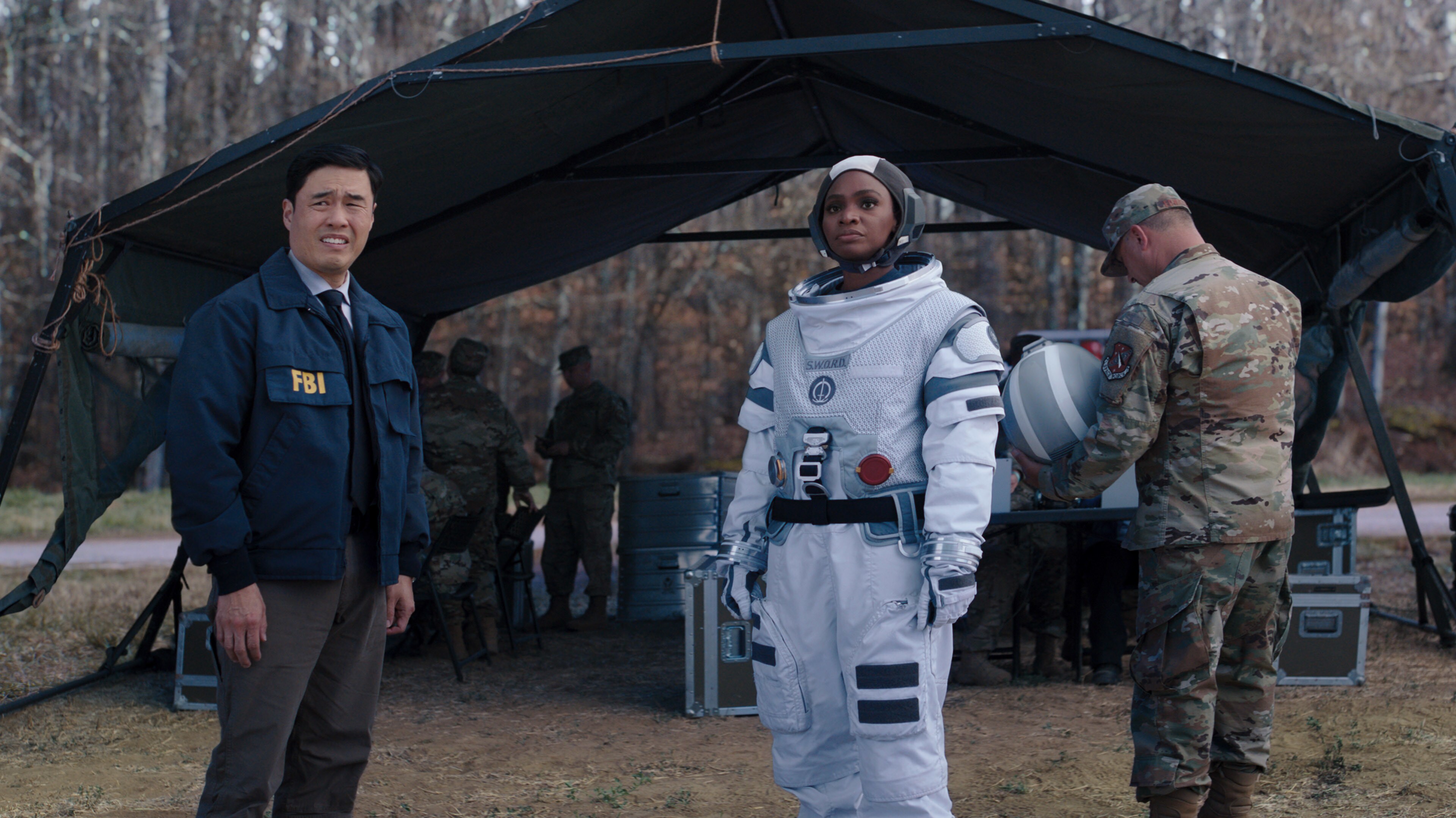 (L-R): Randall Park as Jimmy Woo and Teyonah Parris as Monica Rambeau in Marvel Studios' WANDAVISION exclusively on Disney+. Photo courtesy of Marvel Studios. ©Marvel Studios 2021. All Rights Reserved.