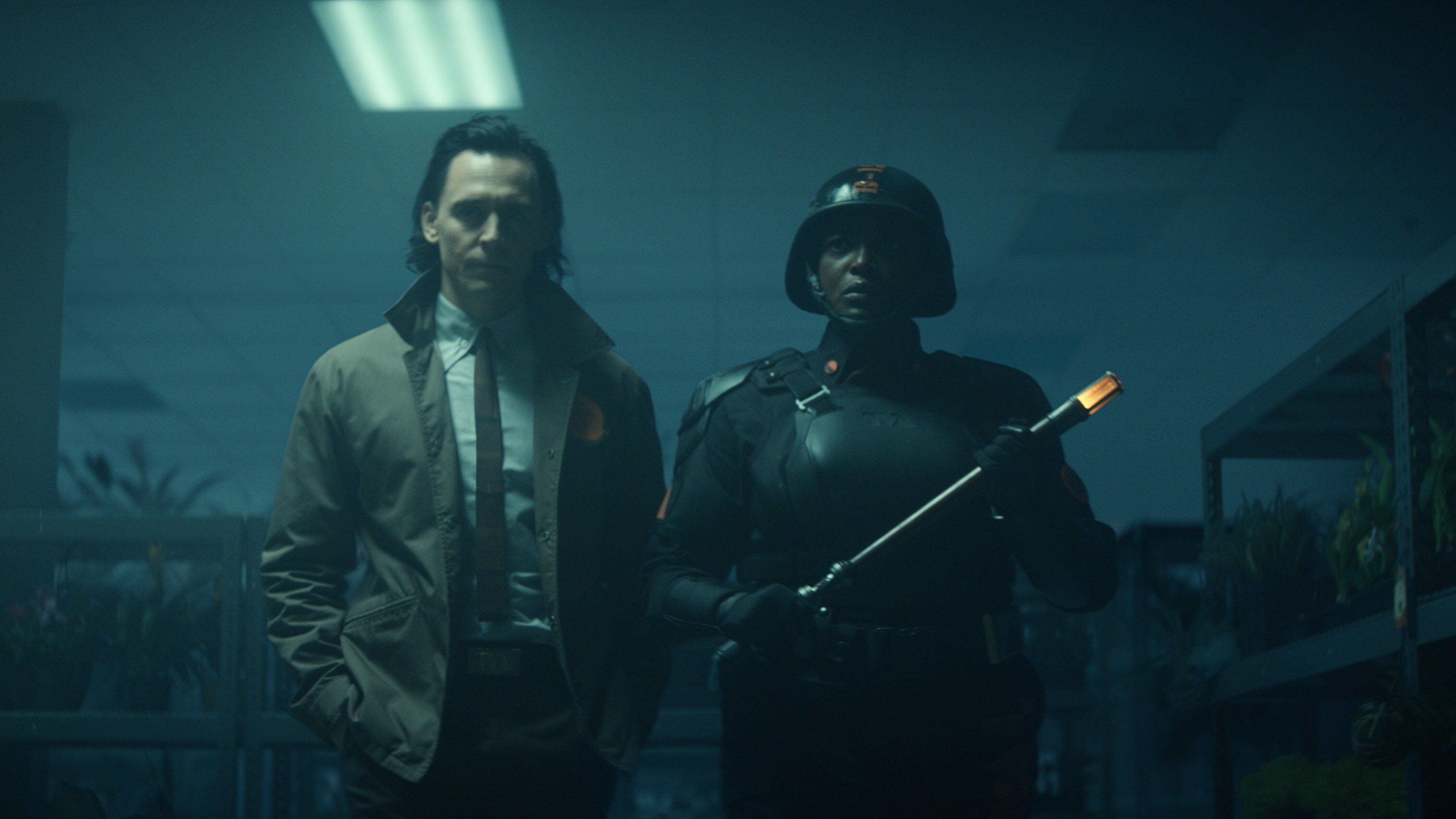 (L-R): Loki (Tom Hiddleston) and Hunter B-15 (Wunmi Mosaku) in Marvel Studios' LOKI, exclusively on Disney+. Photo courtesy of Marvel Studios. ©Marvel Studios 2021. All Rights Reserved.