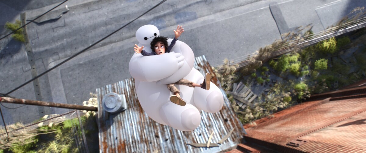 Baymax protects Hiro as they fall off a building in the animated movie "Big Hero 6"