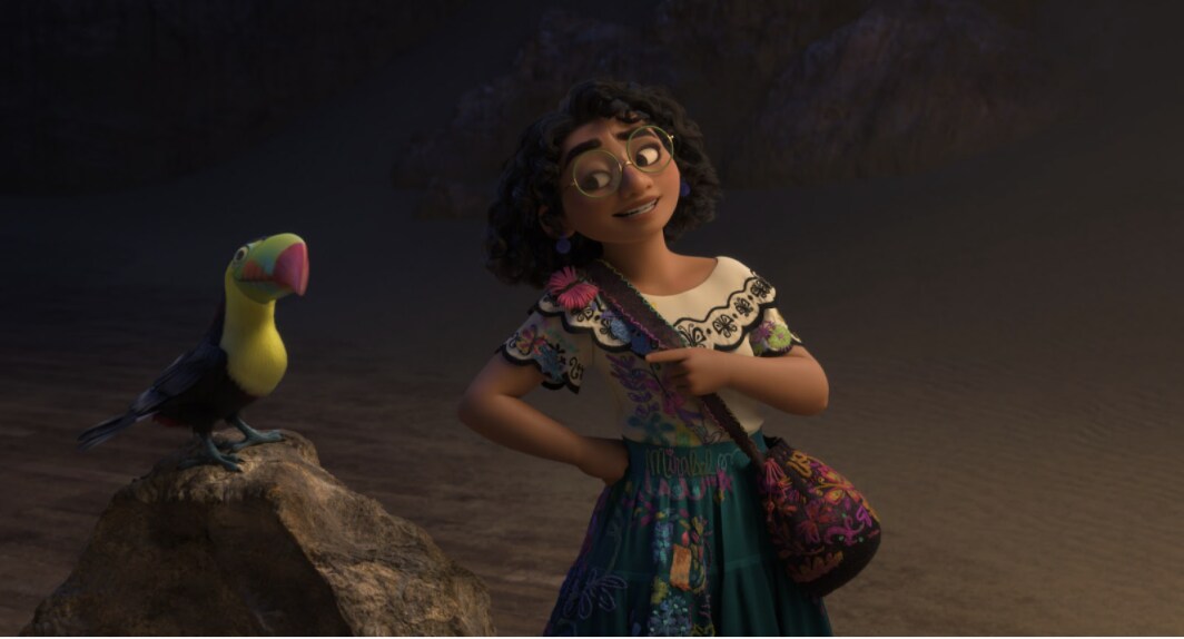 Mirabel smiles at a parrot in Walt Disney Animation Studios' Encanto