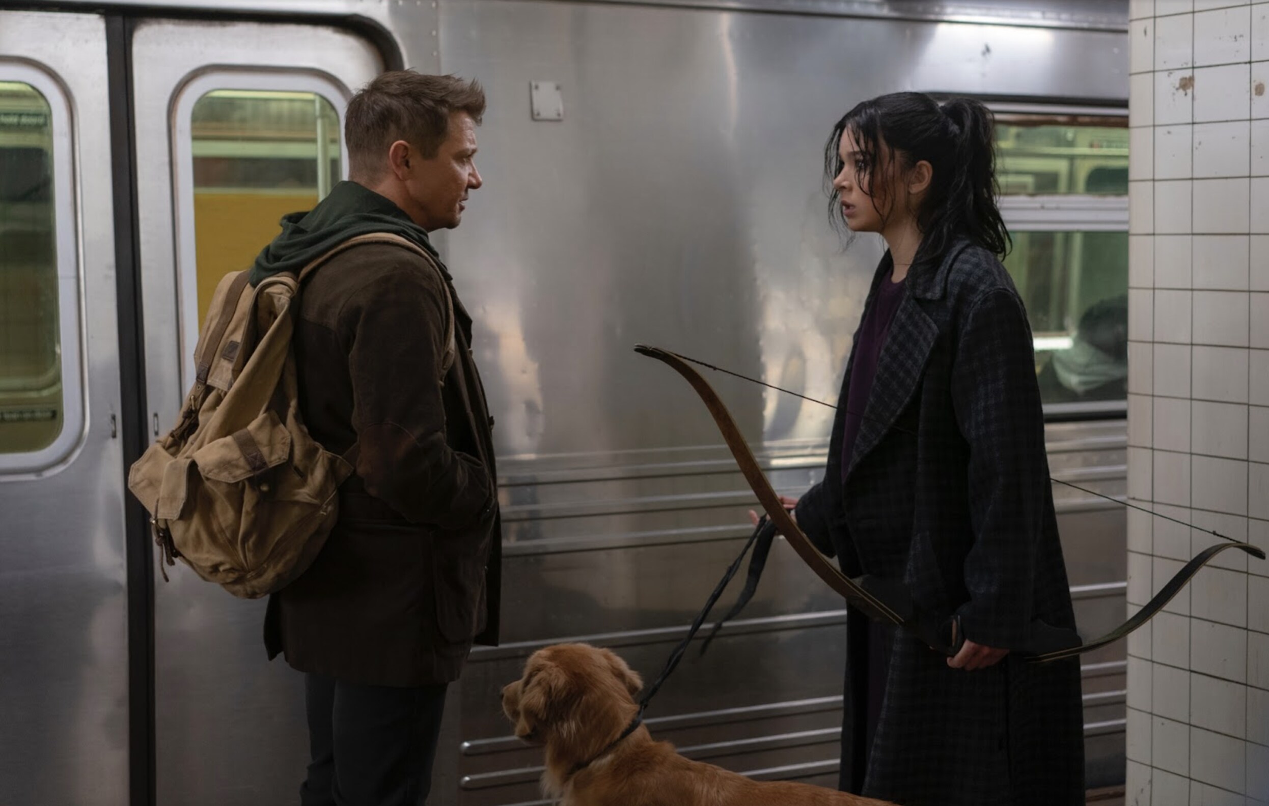 Hawkeye, Kate Bishop, and her dog in the train station in the original series Hawkeye 