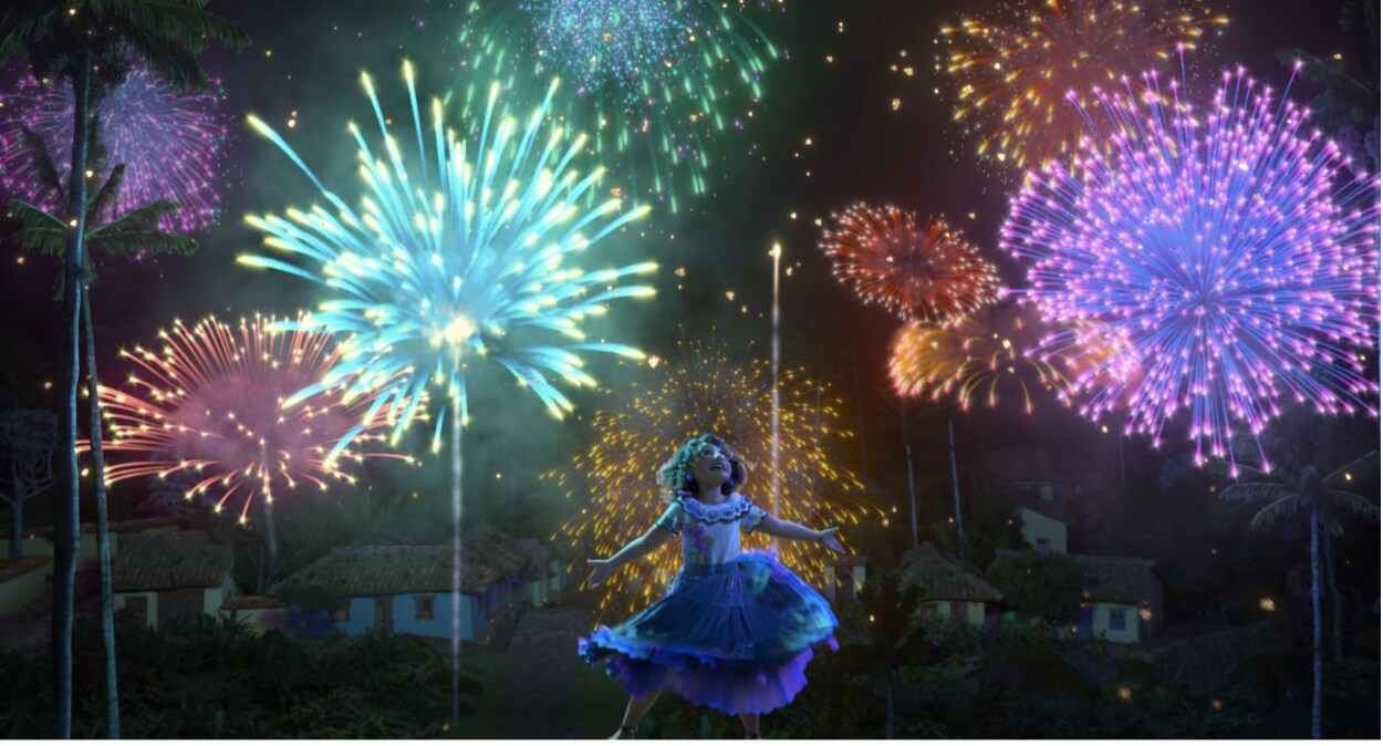 Colorful fireworks fill the air as Mirabel watches in delight with her arms open.