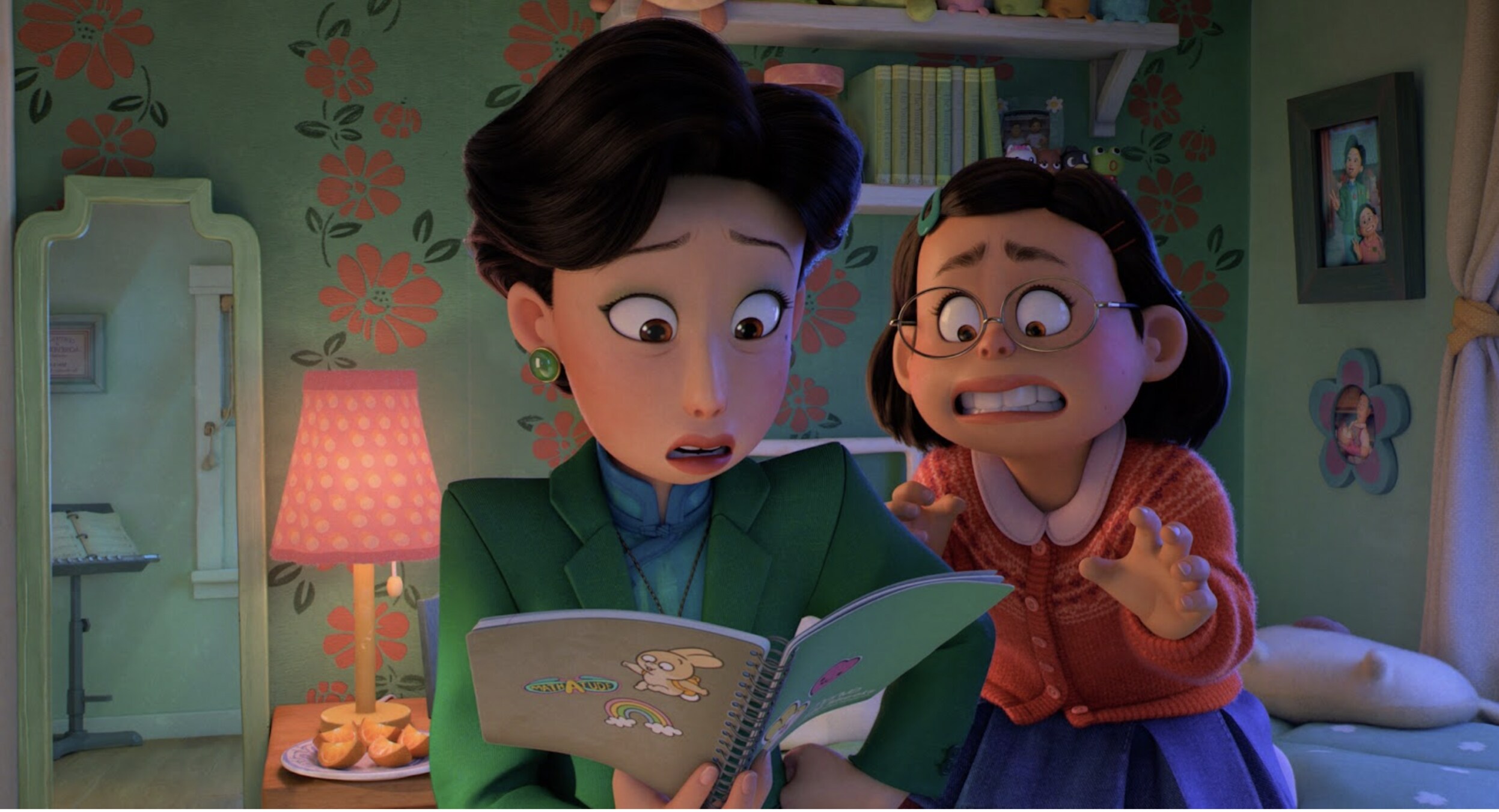 Mei's mom looks in her notebook in shock as she is horrified in Disney and Pixar's Turning Red