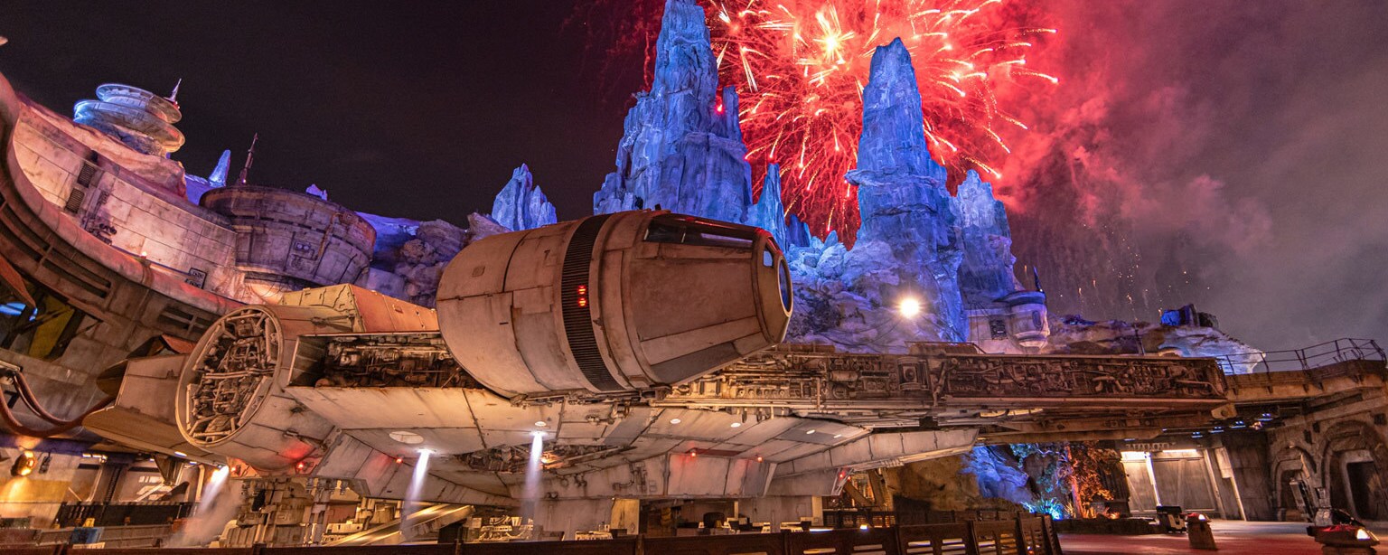 The Millennium Falcon at Star Wars: Galaxy's Edge with fireworks at night