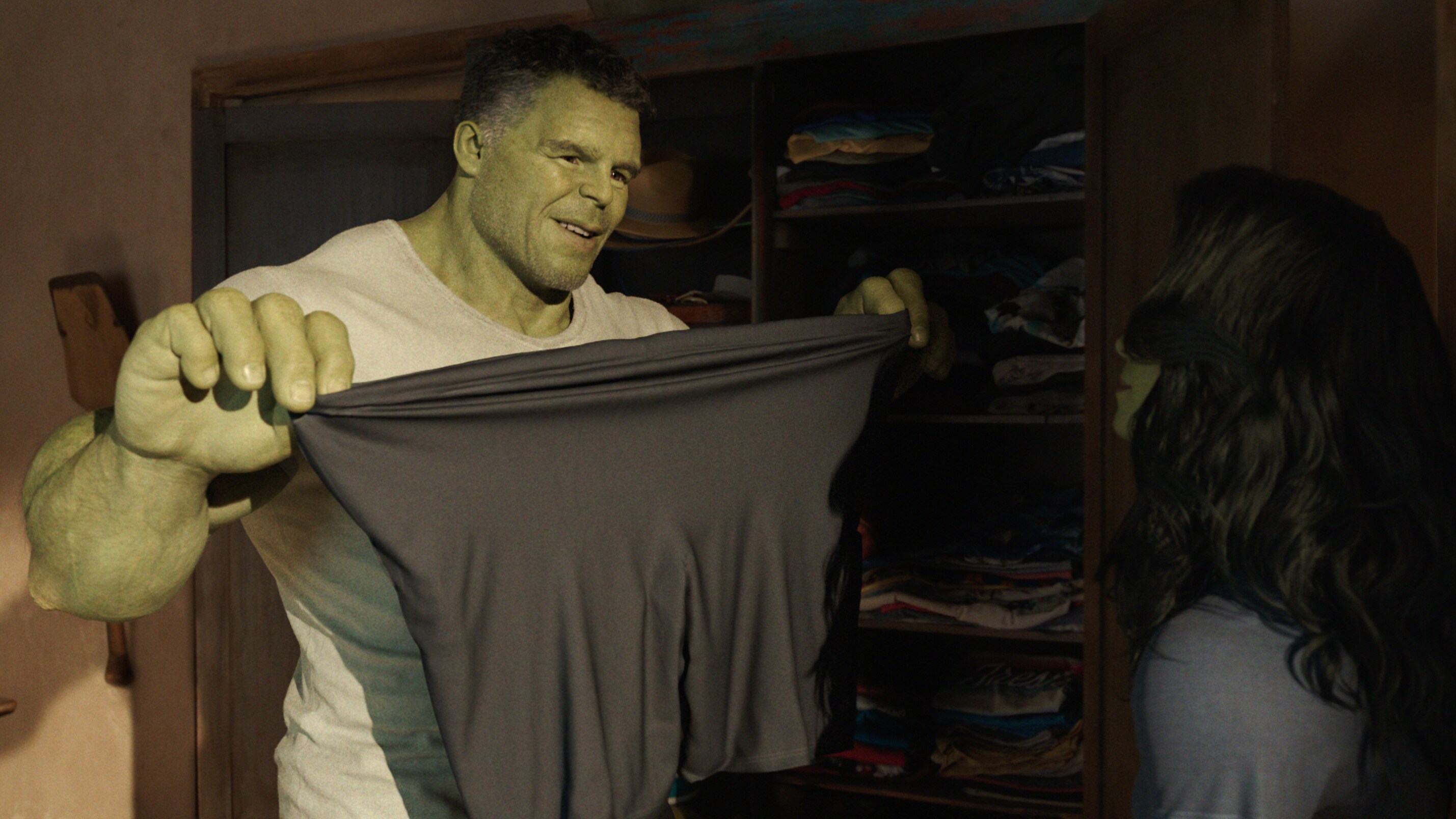 Hulk putting on t-shirt.