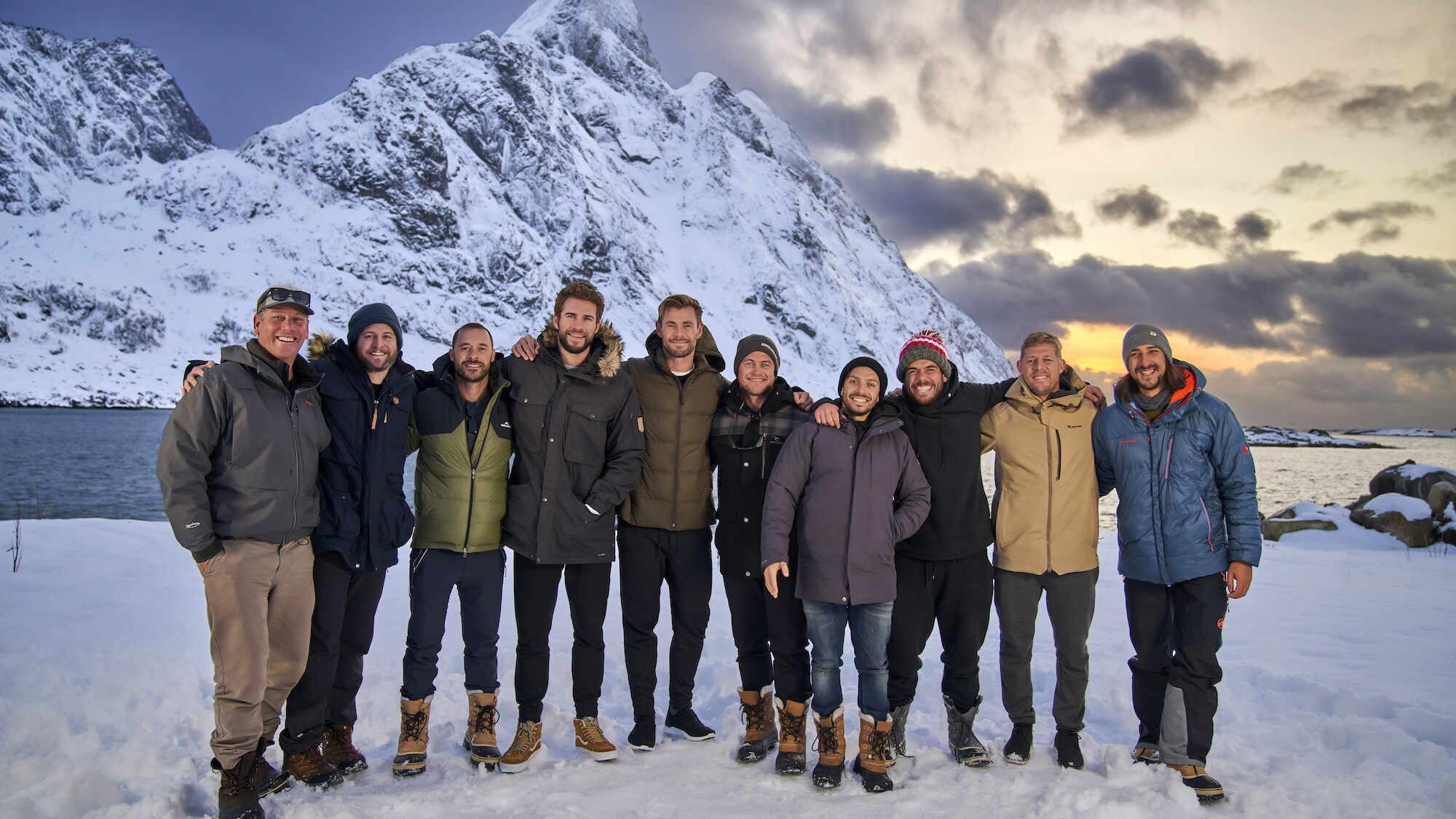From left: Craig Parry, Ben Grayson, Aaron Grist, Liam Hemsworth, Chris Hemsworth, Luke Hemsworth, Luke Zocchi, Ross Edgley, Mick Fanning, Cristian Prieto in Norway.  (photo credit: National Geographic for Disney+/Craig Parry)