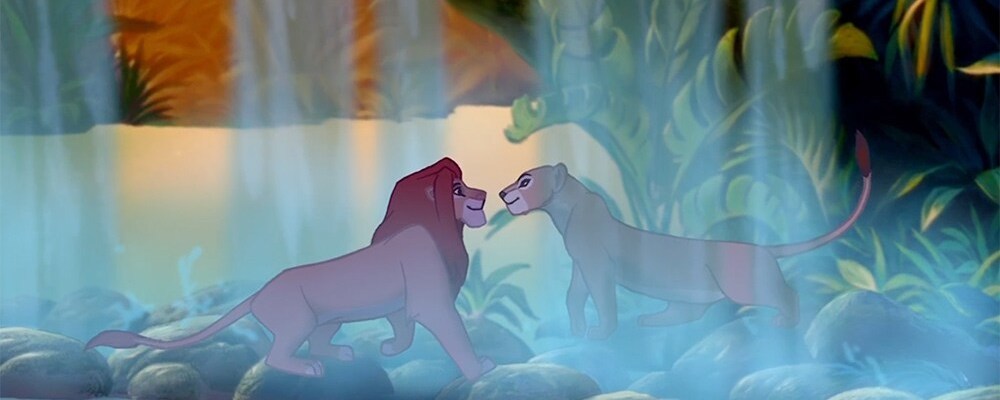 Animated characters Simba and Nala (lions) under a waterfall in the film "The Lion King"