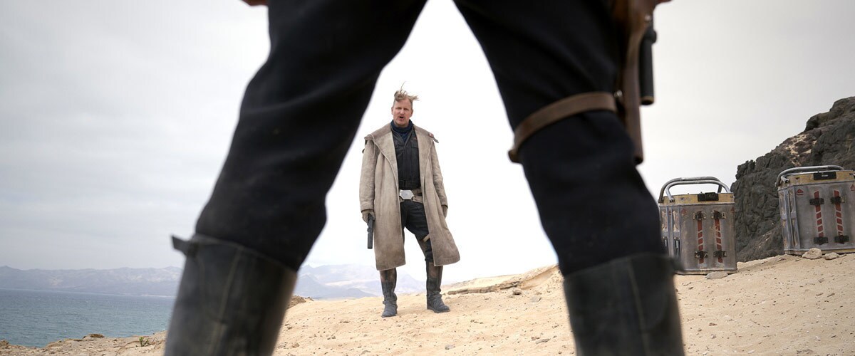 Tobias Beckett entering into a standoff with Han Solo Tobias Beckett entering into a standoff with Han Solo