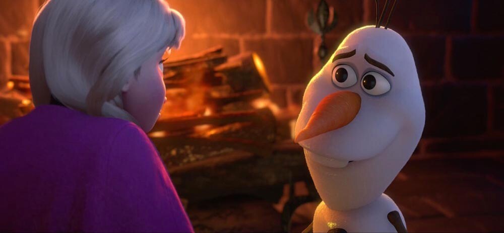 Animated characters Anna and Olaf in front of a fireplace