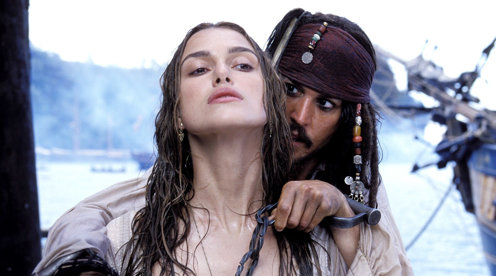 In their first encounter, Captain Jack Sparrow takes Elizabeth Swann hostage to effect an escape.