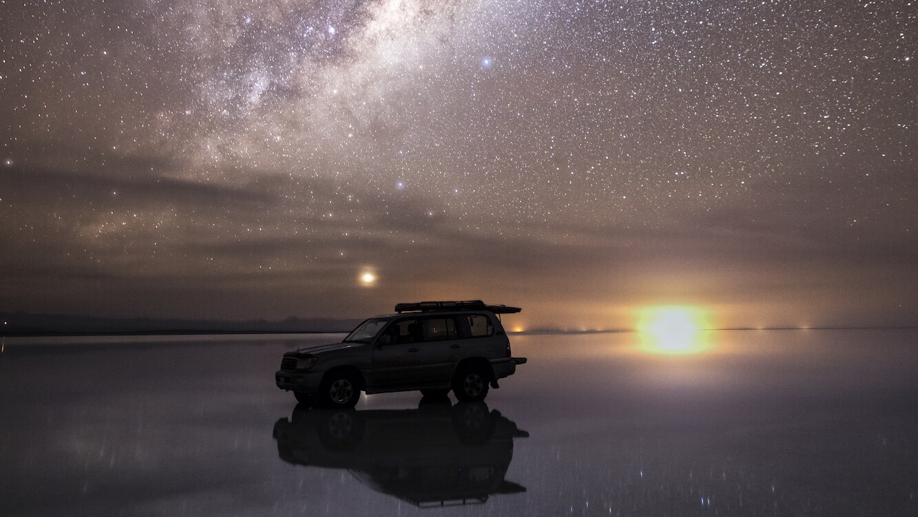The milky way reflected in the flood waters of the salar, after seasonal rains transform the salt flats into the largest mirror on the planet.  (National Geographic/Freddie Claire)
