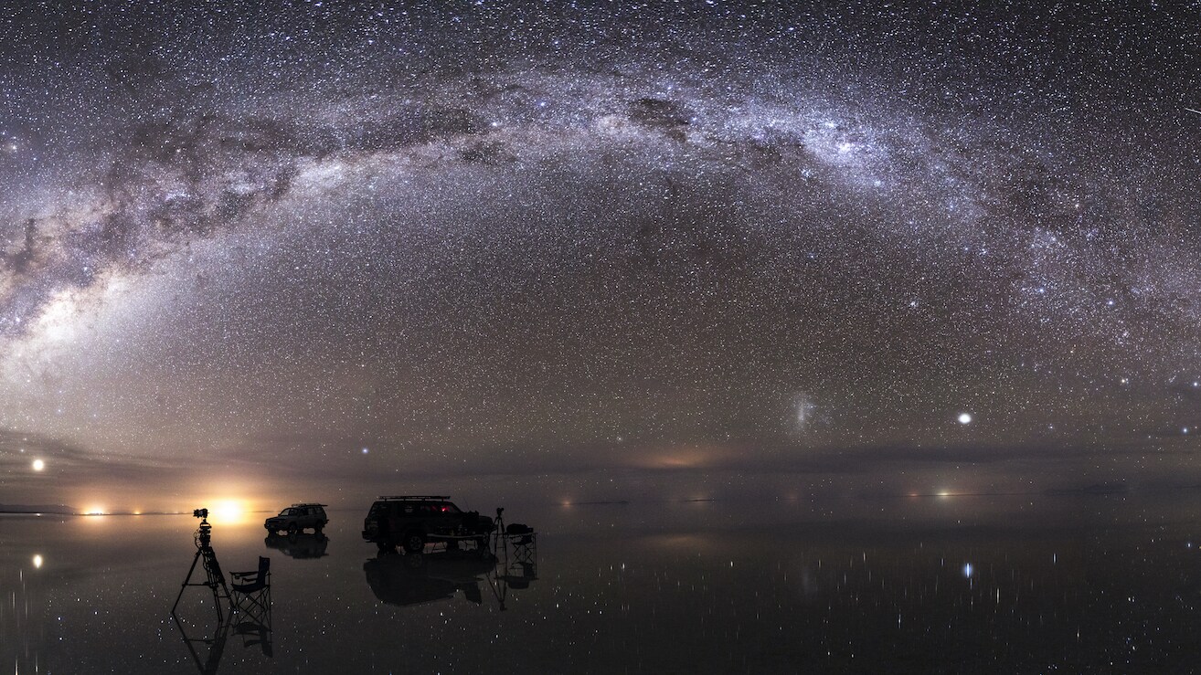 The milky way reflected in the flood waters of the salar, after seasonal rains transform the salt flats into the largest mirror on the planet.  (National Geographic/Freddie Claire)
