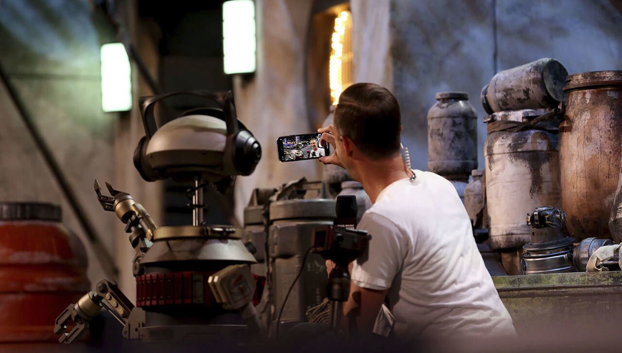 Gil poses for a selfie on stage at Star Wars Celebration.