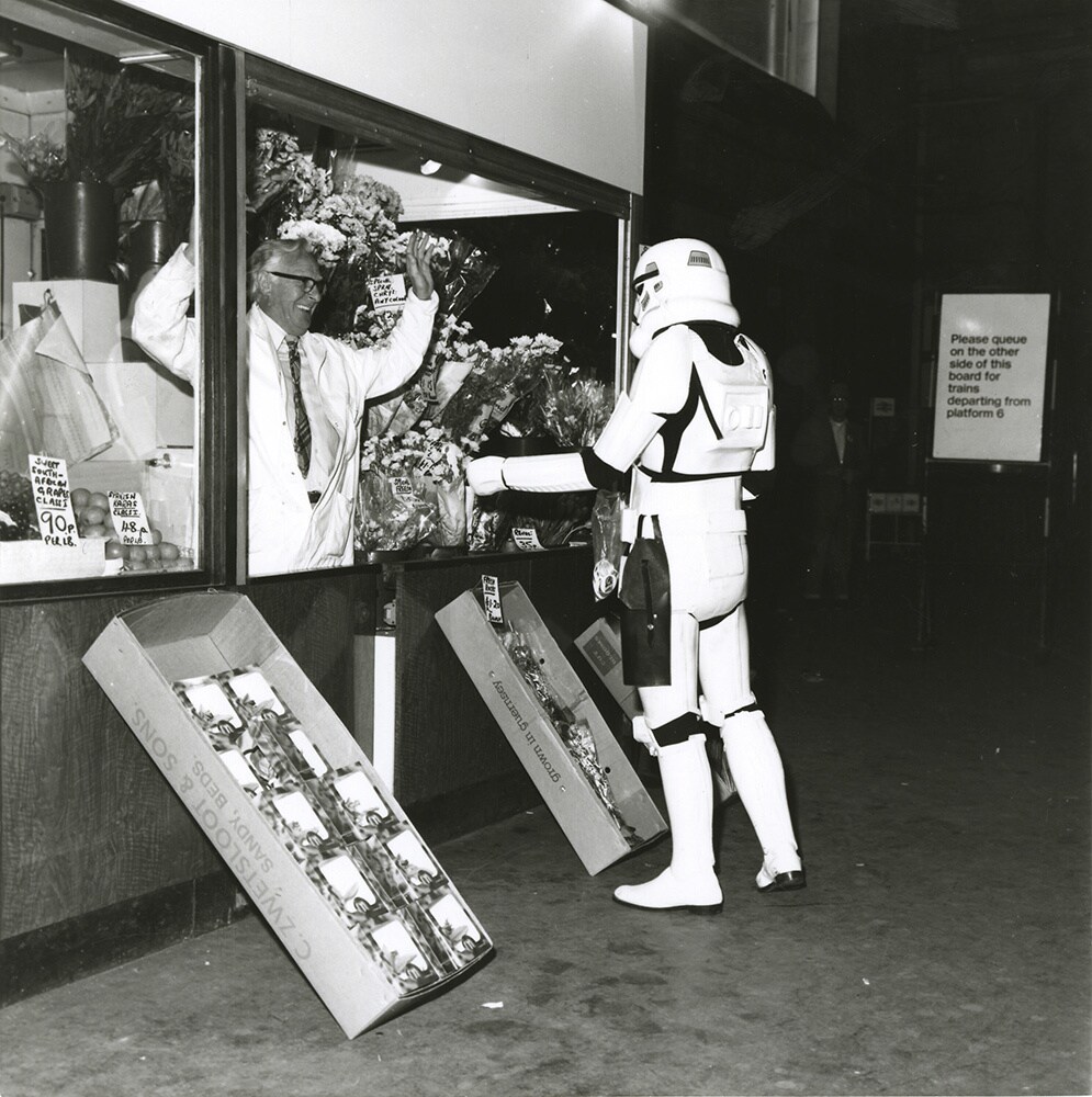 A stormtrooper meets a London flower seller during “Empire Day” in 1980. 