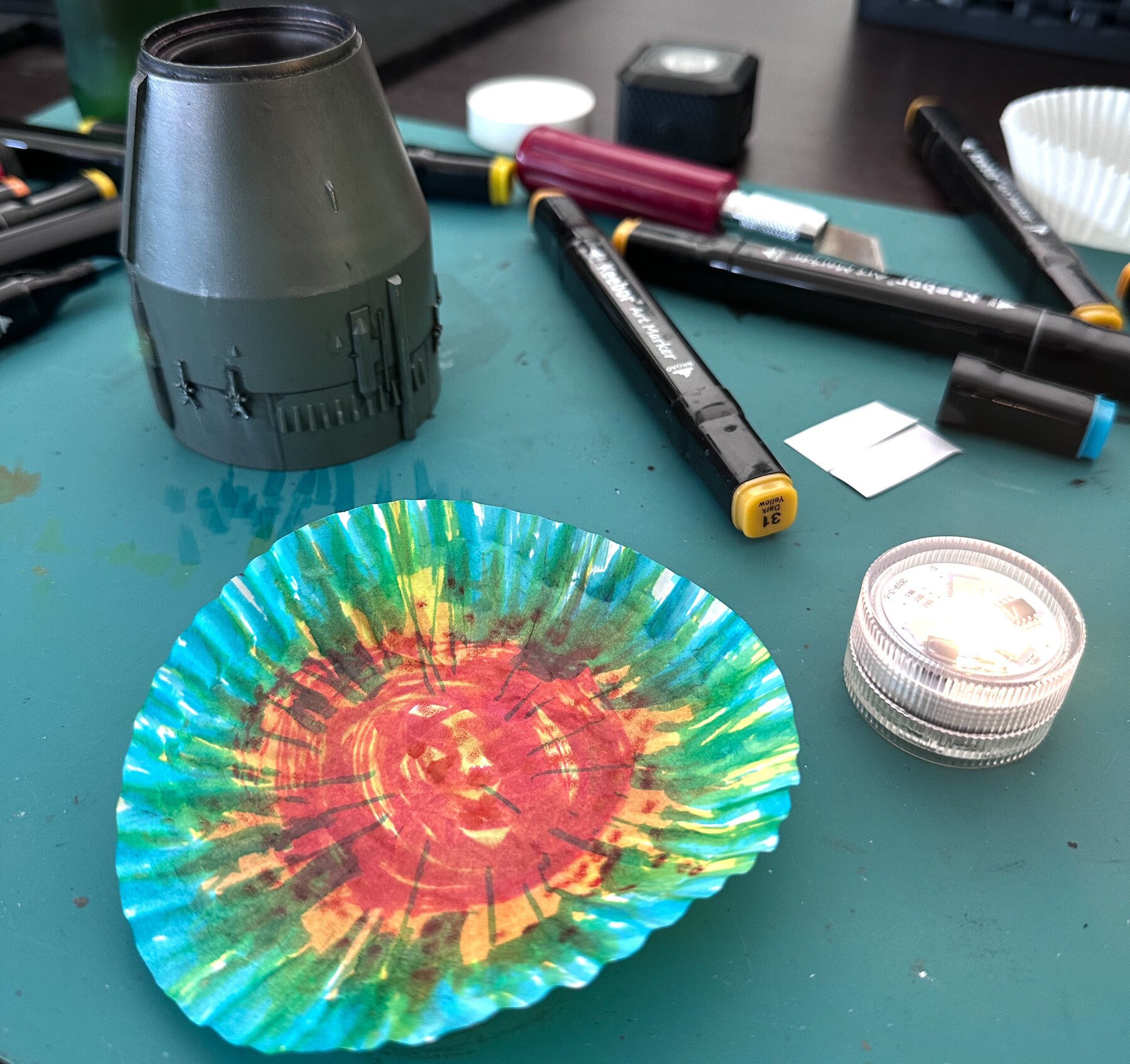A cupcake holder with added color proved an excellent means of creating engine glow.