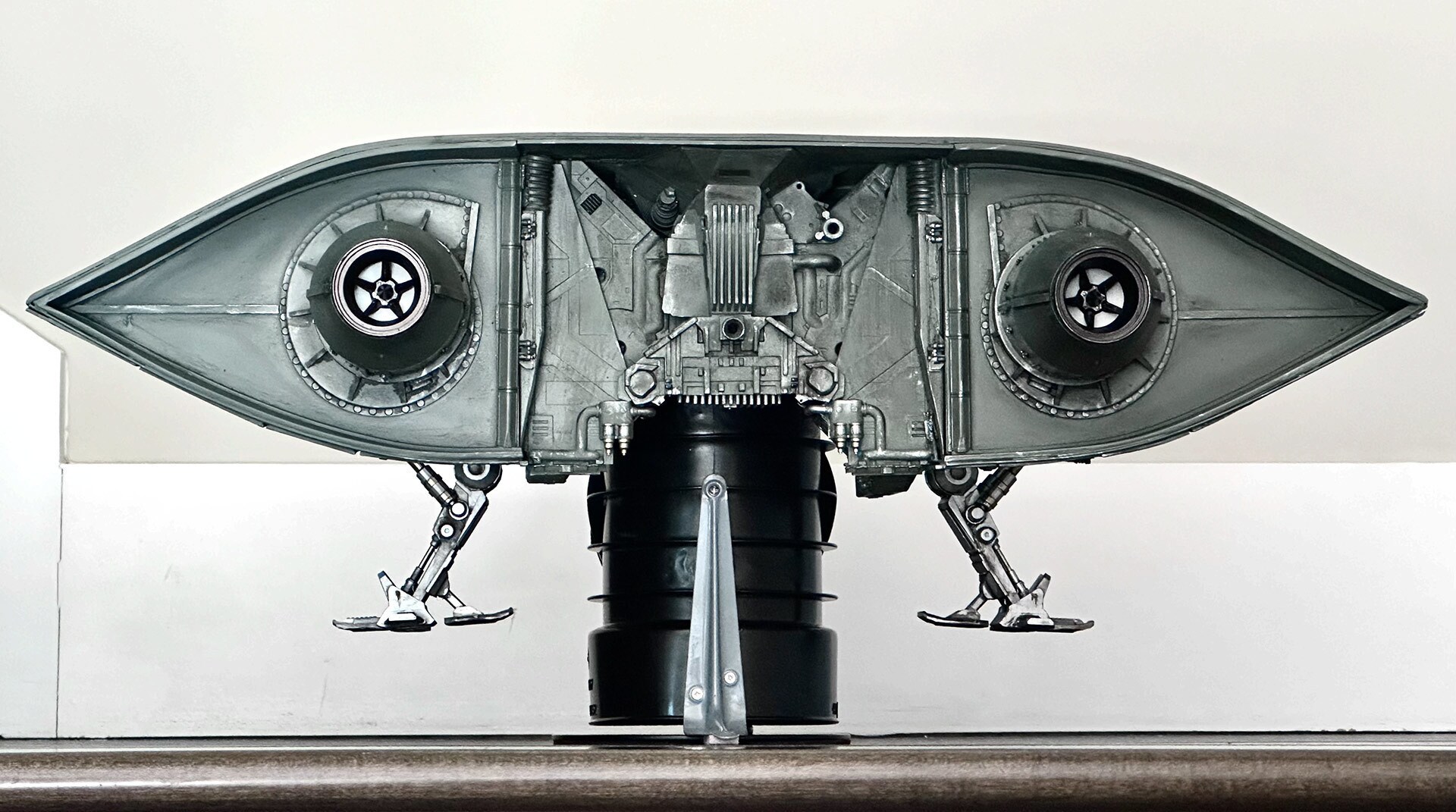 The final miniature ready for shooting. Aron staged it on a t-joint normally used as a hot tub drain.