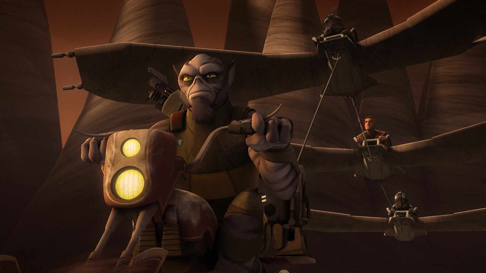Zeb riding on a speeder with Sabine, Ezra and Kanan on gliders behind him