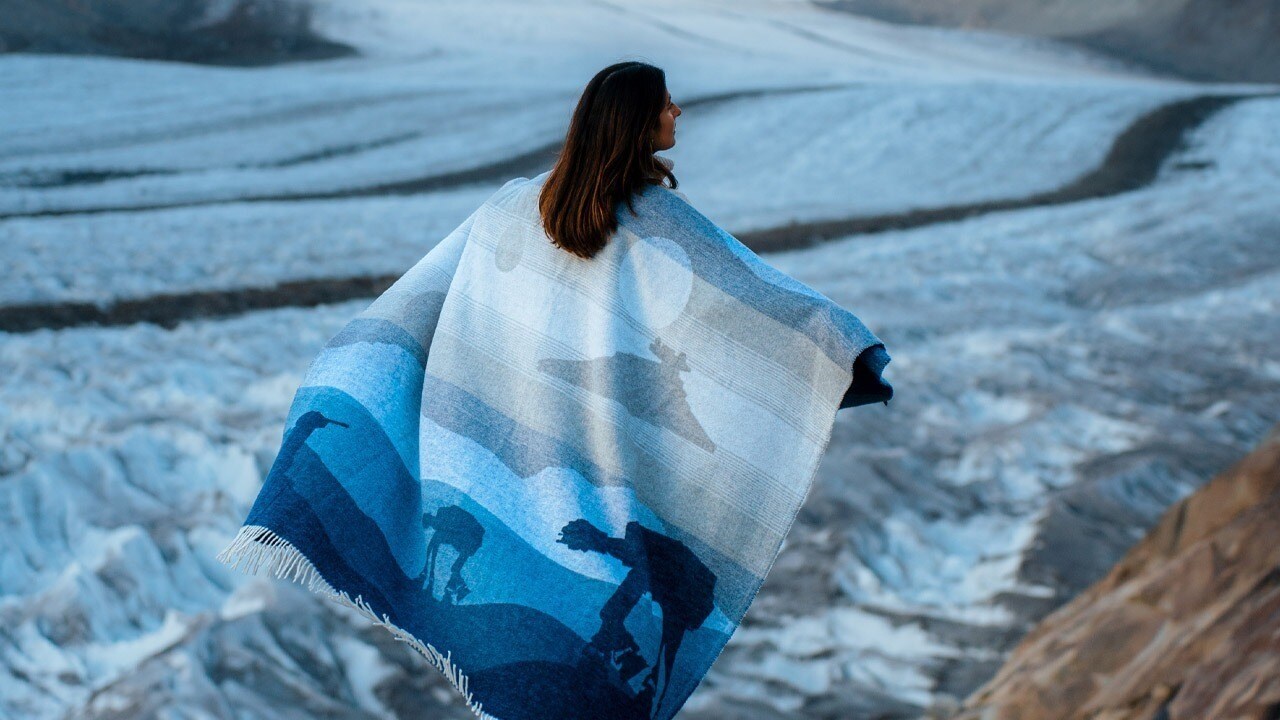 Person wearing AT-AT blanket overlooking snow