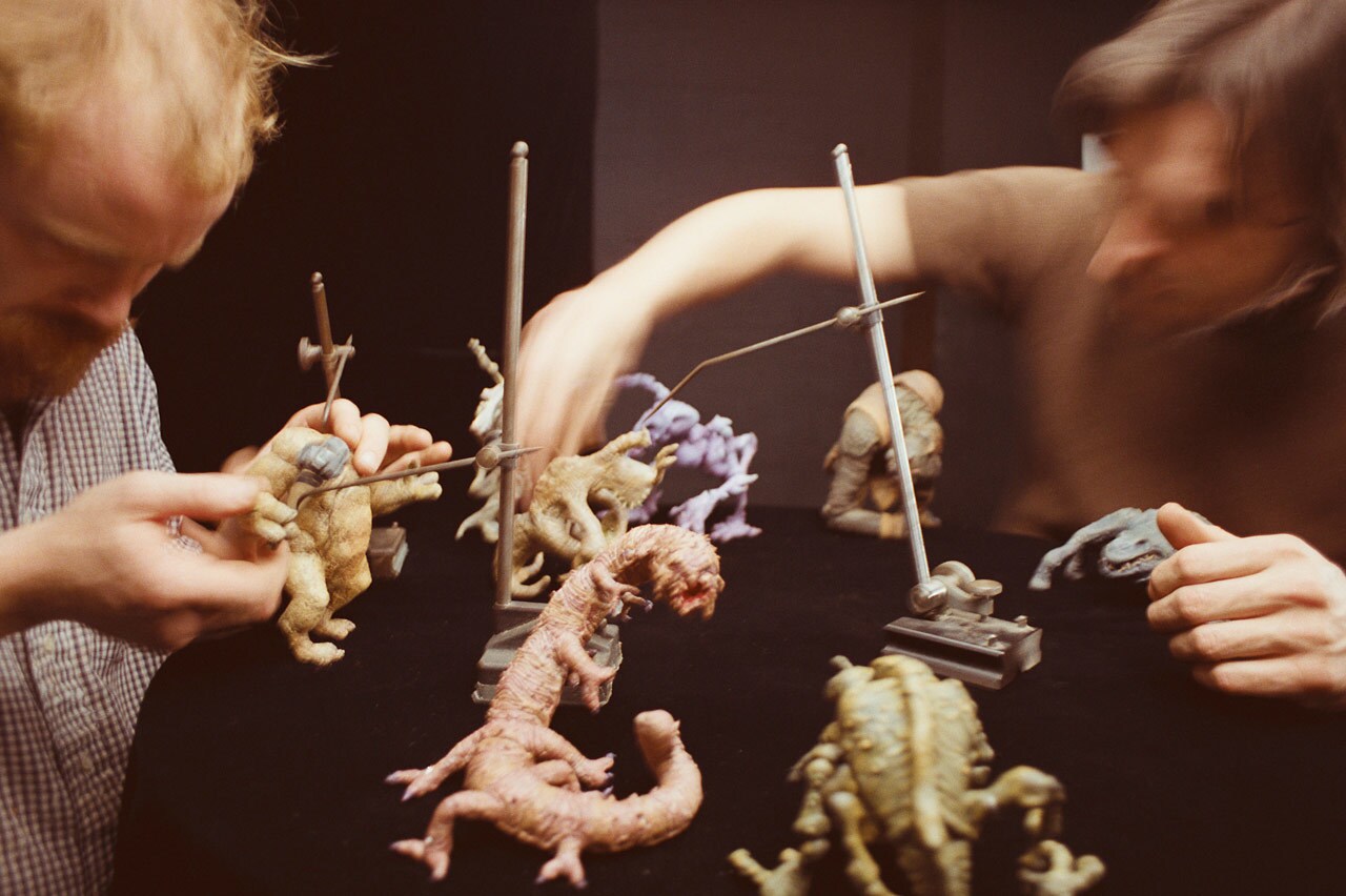 Phil Tippett uses stop-motion puppets to move holochess aliens on set of Star Wars: A New Hope.