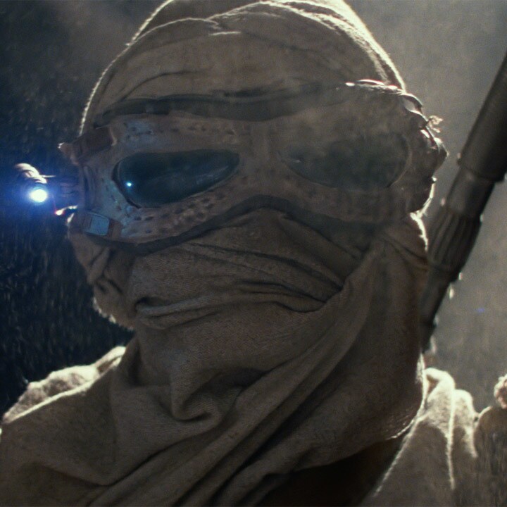 Rey scavenging on Jakku.