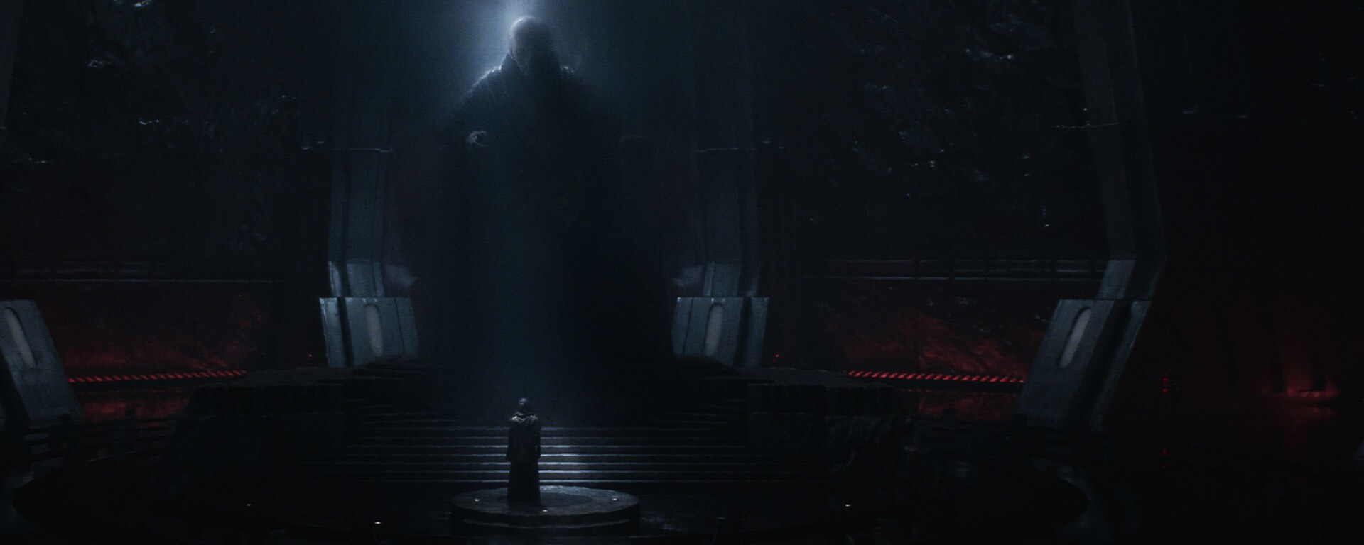 Supreme Leader Snoke looms over Kylo Ren.