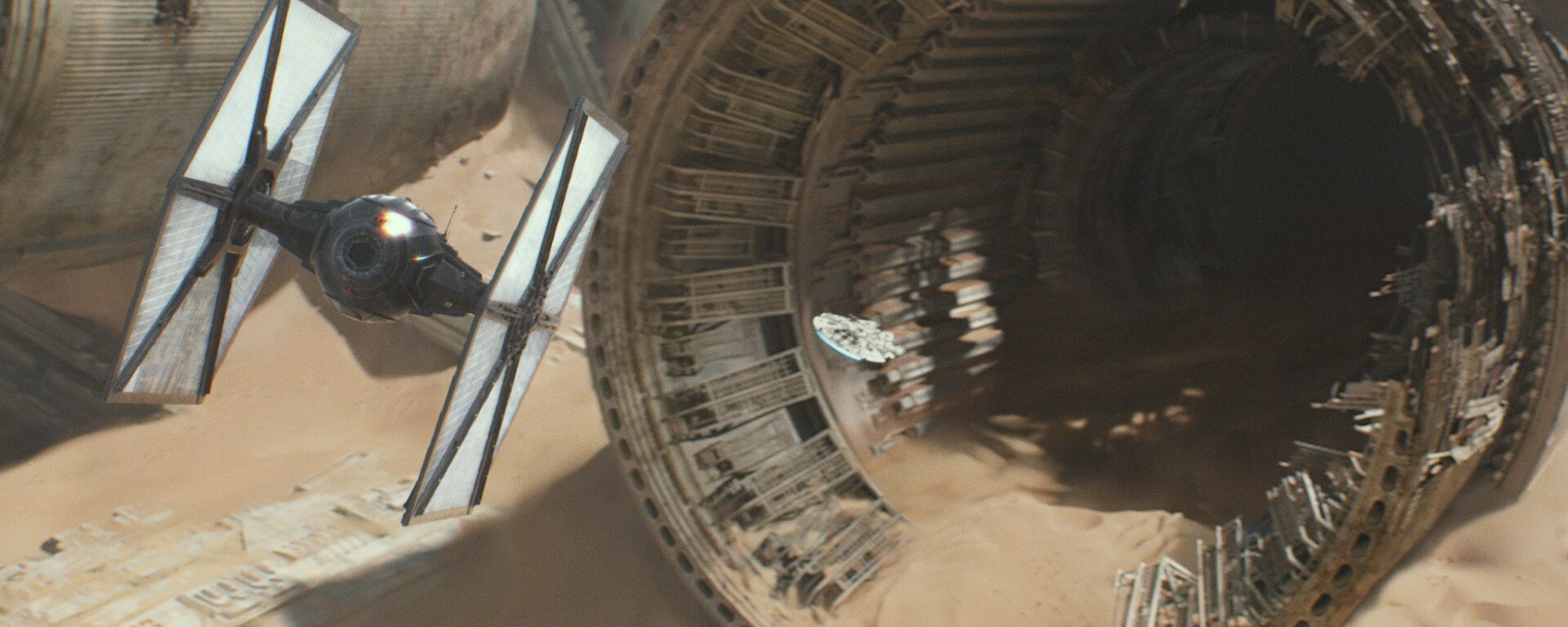 The dogfight between a group of TIE fighters and the Millennium Falcon evading the First Order on Jakku.