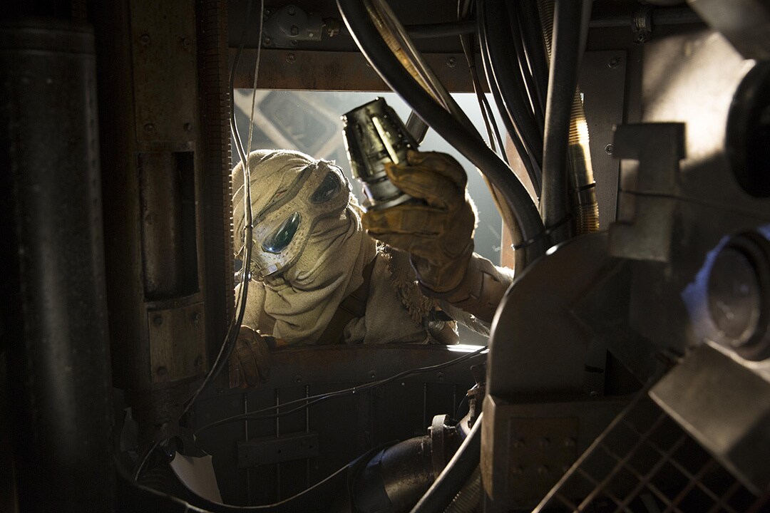 The masked scavenger, Rey, in The Force Awakens, looking for parts in an abandoned Star Destroyer.