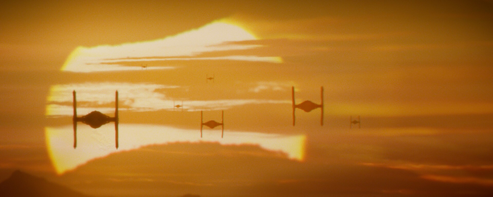 TIE Fighters against Jakku’s singular star.