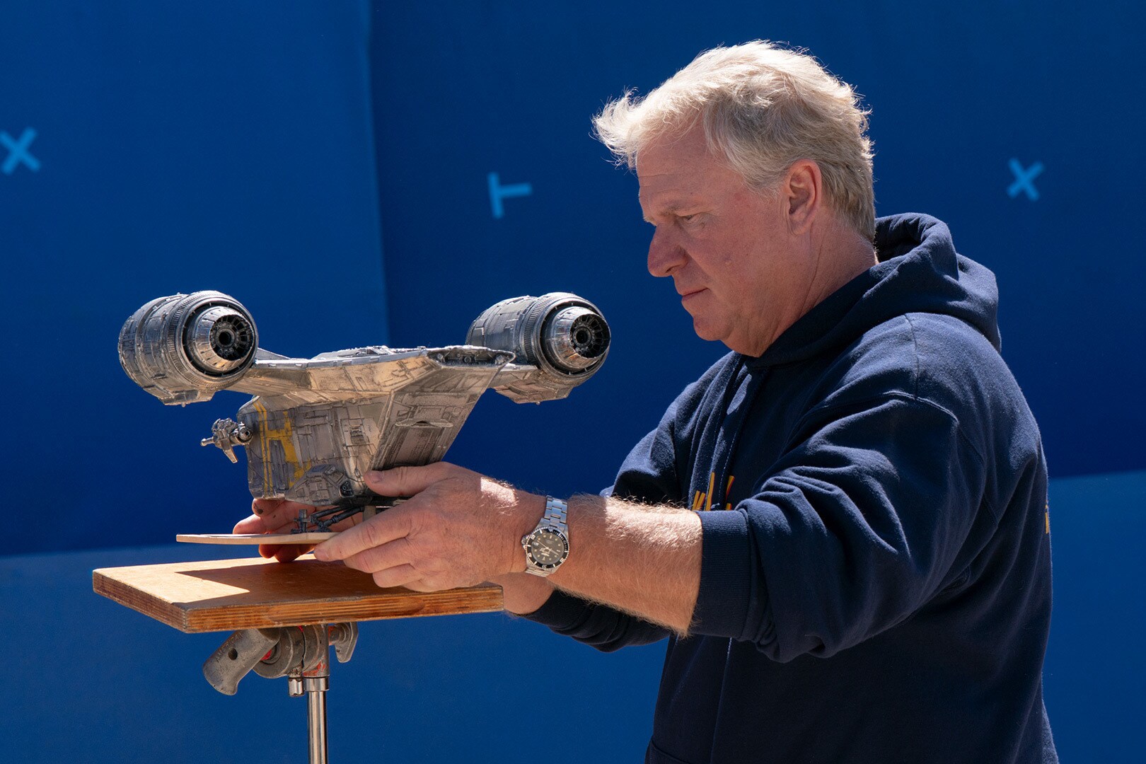 John Goodson on set with the 24-inch Razor Crest model.