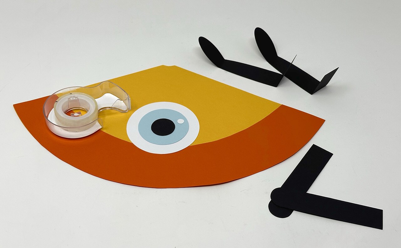 The eye cut out of the Droid Desk Buddy craft inspired by Star Wars: Visions.