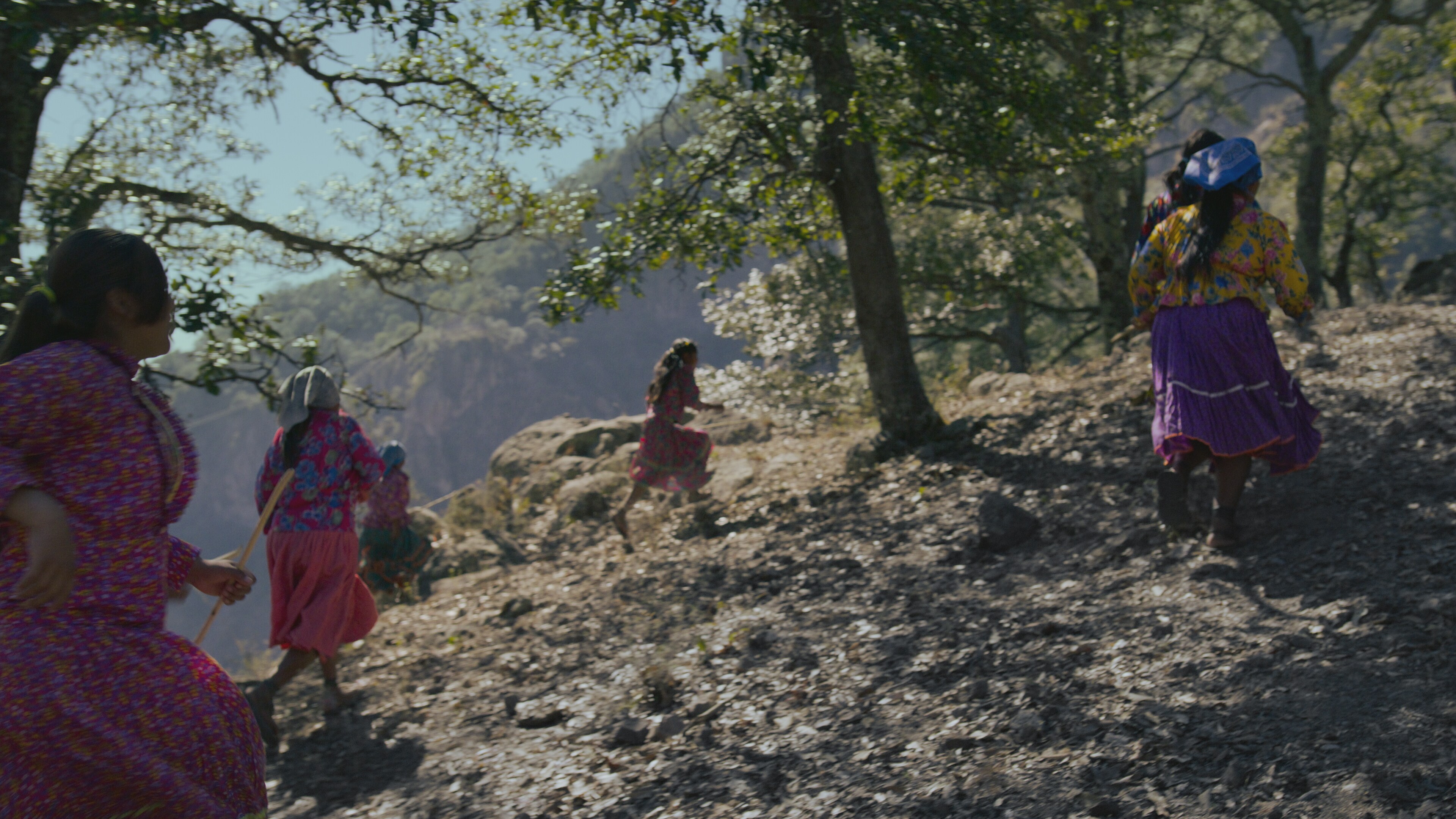 Raramuri women run through the mountains. (National Geographic for Disney+)