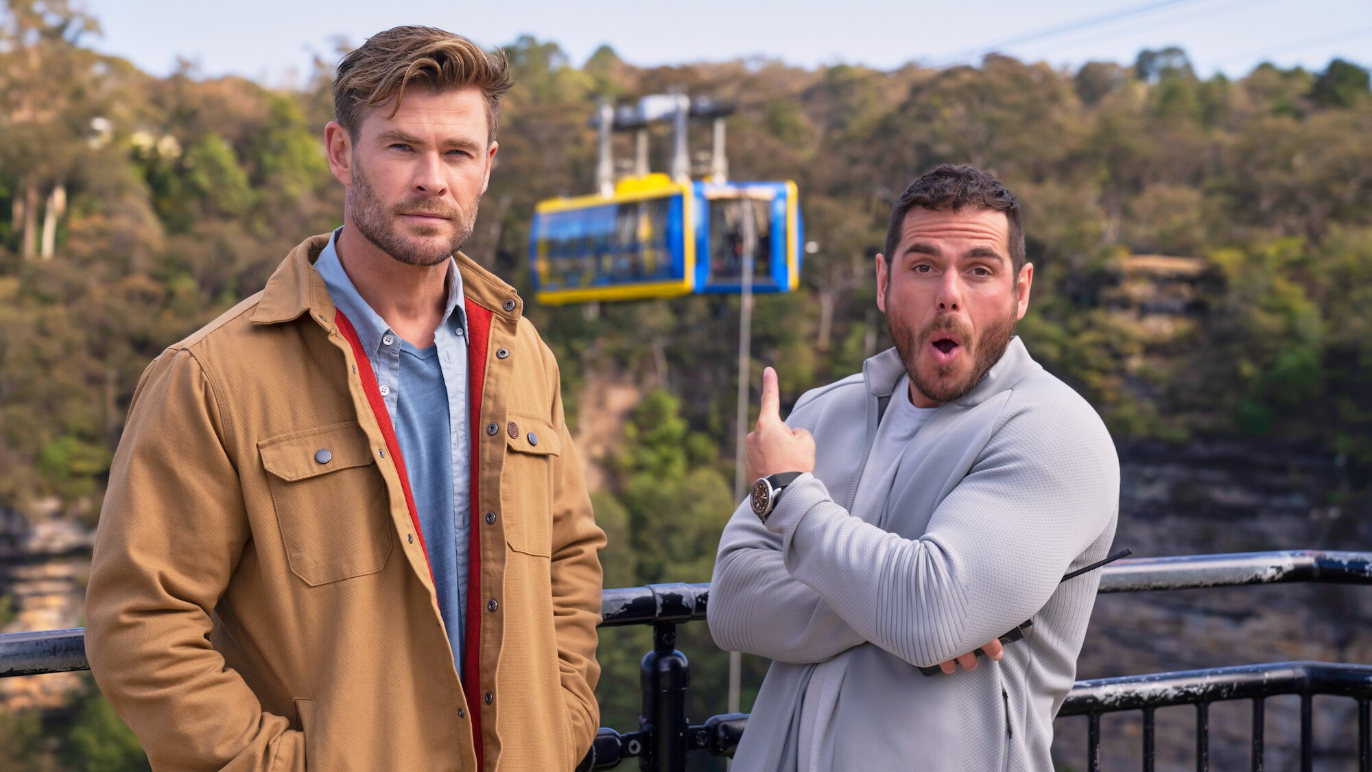 Chris Hemsworth and sports scientist Ross Edgley pose in front of Chris' next challenge: an extreme rope climb. (National Geographic for Disney+/Craig Parry)
