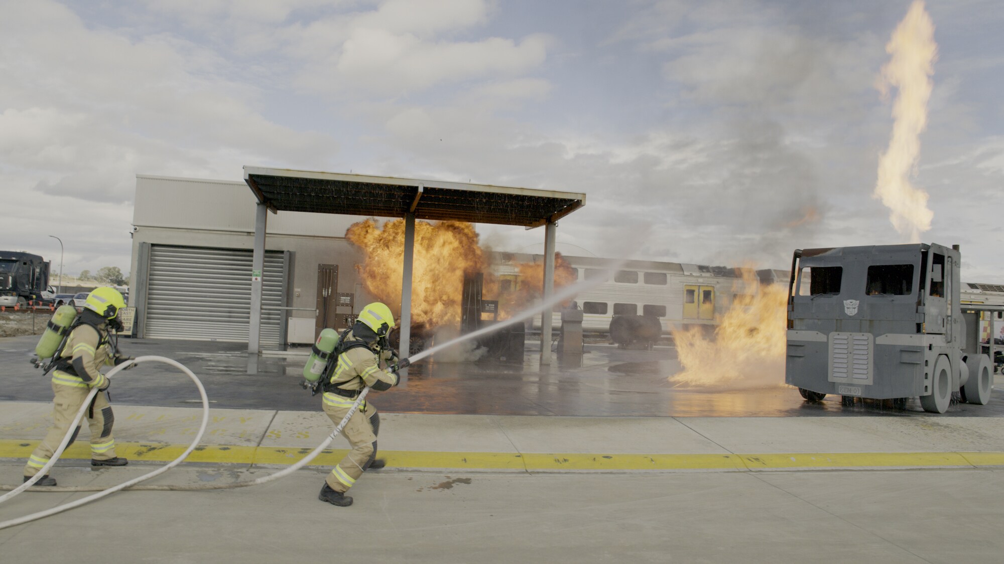 New South Wales Firefighters put out a fire outside during a training exercise. (National Geographic for Disney+)