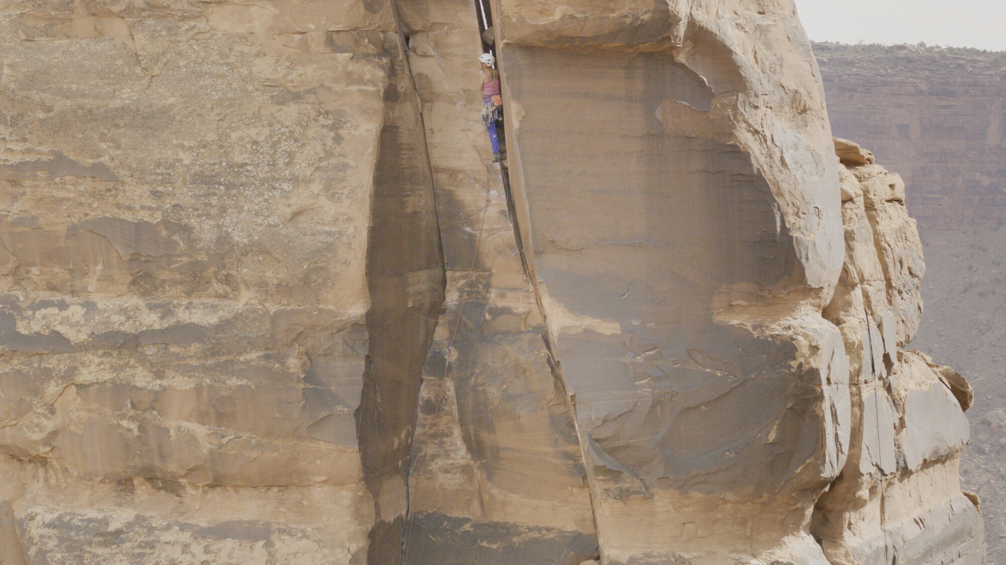 Faith Dickey climbs a rock formation. (National Geographic for Disney+)