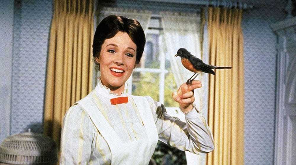 Mary Poppins with a bird sitting on her finger.