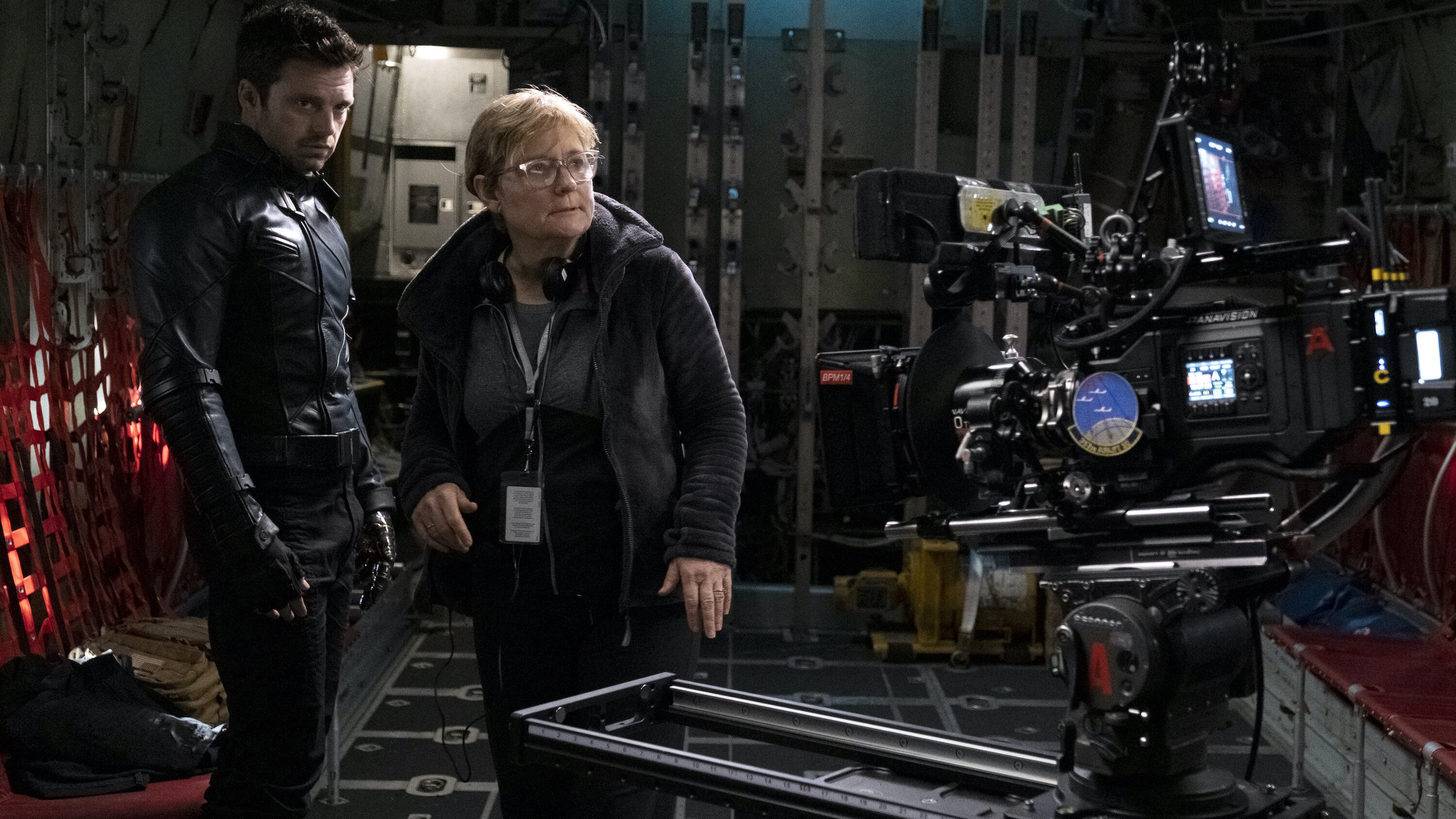 (L-R): Winter Soldier/Bucky Barnes (Sebastian Stan) and Director Kari Skogland on the set of Marvel Studios' THE FALCON AND THE WINTER SOLDIER exclusively on Disney+. Photo by Chuck Zlotnick. ©Marvel Studios 2020. All Rights Reserved.