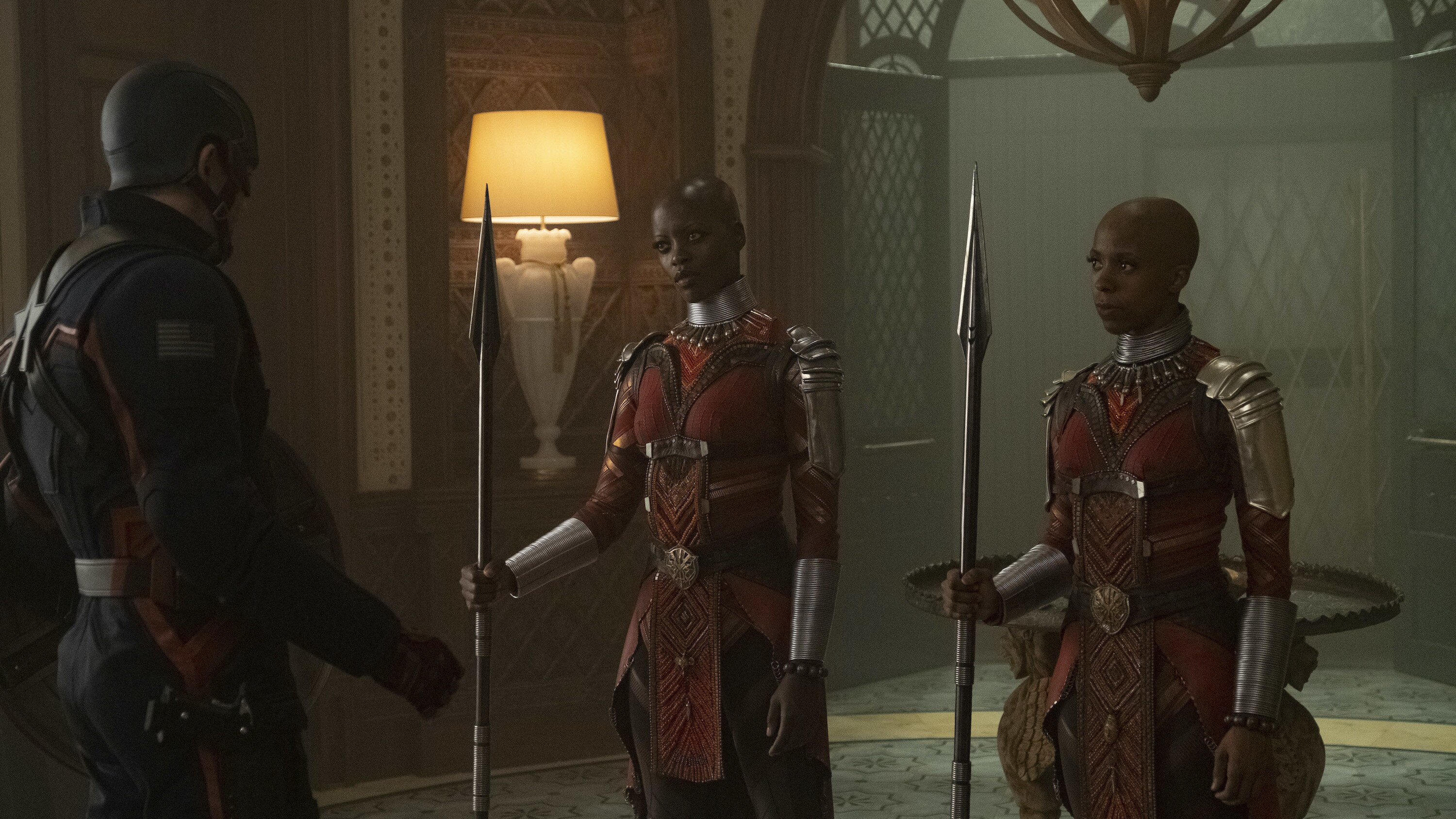 (L-R): John Walker (Wyatt Russell), Ayo (Florence Kasumba) and Yama (Zola Williams) in Marvel Studios' THE FALCON AND THE WINTER SOLDIER exclusively on Disney+. Photo by Chuck Zlotnick. ©Marvel Studios 2021. All Rights Reserved.