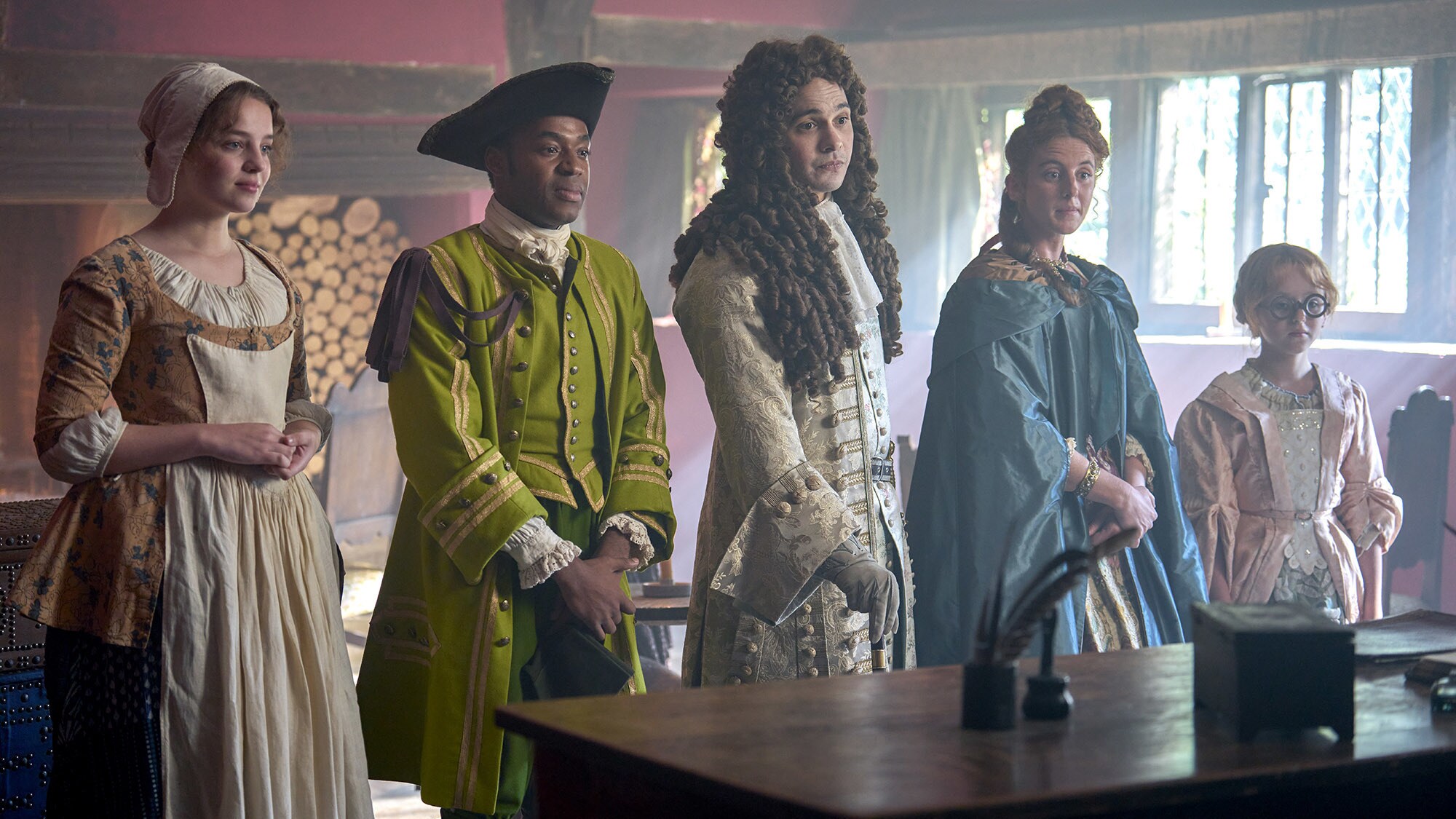 (L-R): Bo Bragason as Roxy Trotter, Ényì Okoronkwo as Rasselas, Frank Dillane as Charles Devereux, Louisa Harland as Nell Jackson, and Florence Keen as George Trotter in Disney's RENEGADE NELL, Season 1, exclusively on Disney+. Photo by Robert Viglasky. © 2024 Disney Enterprises, Inc. All Rights Reserved.