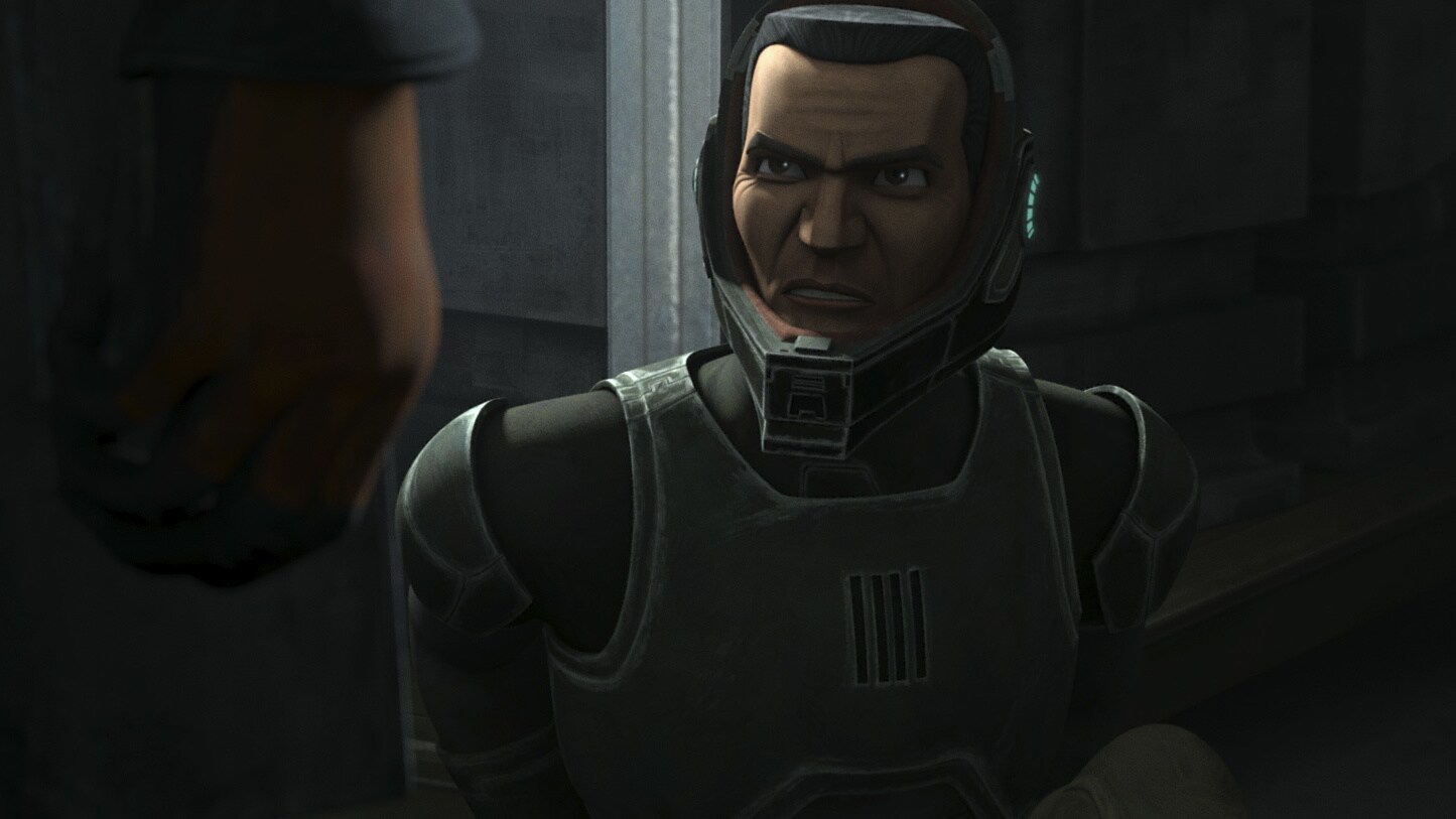 Rex inspects the downed assassin, removing his helmet to reveal the face of a clone. 