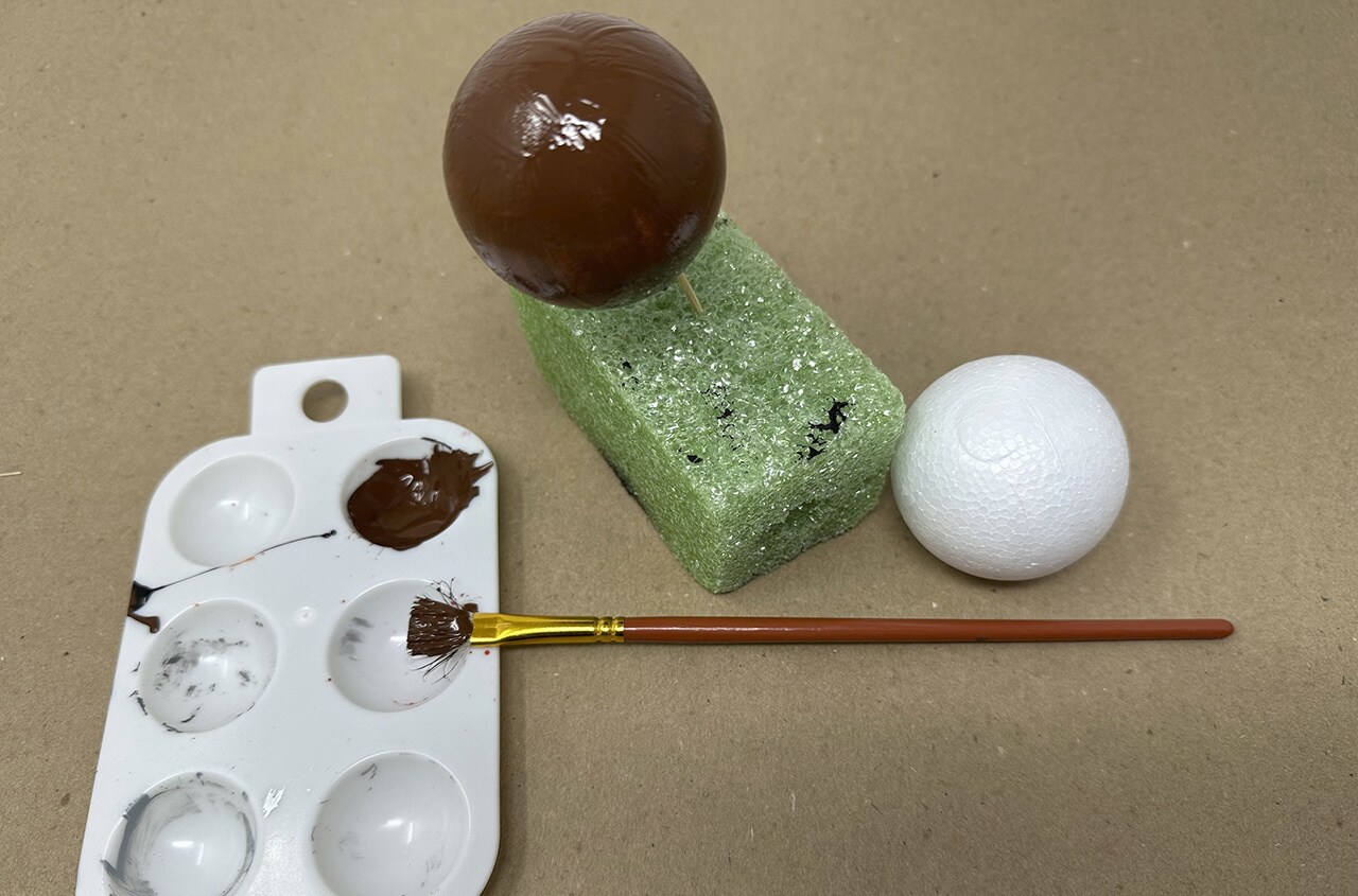 Step 1: Paint one Styrofoam ball with the dark brown acrylic paint and let dry.