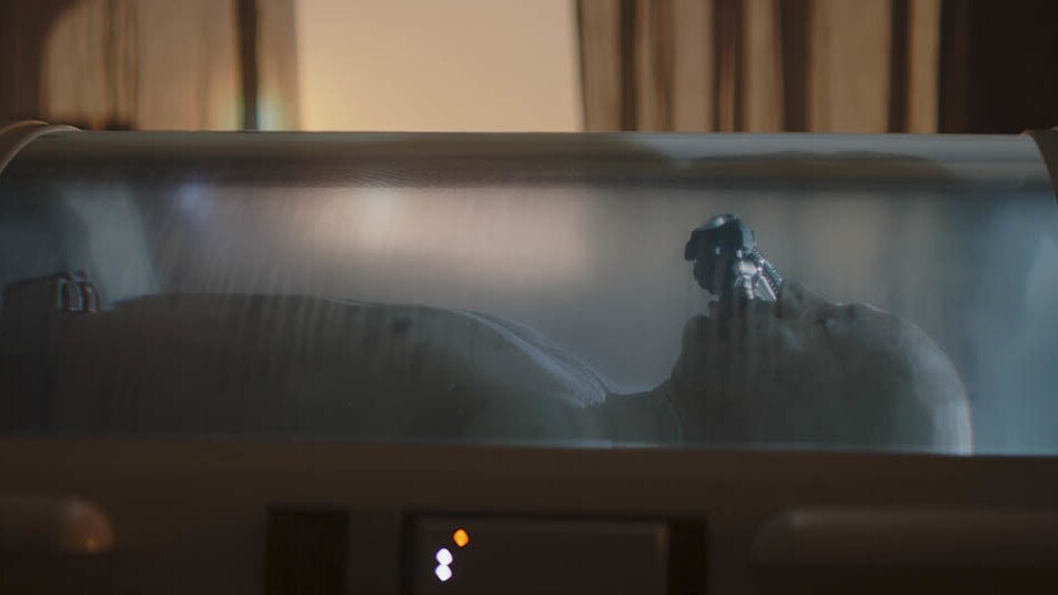 Boba Fett sleeps in a bacta tank, amid visions of his past.