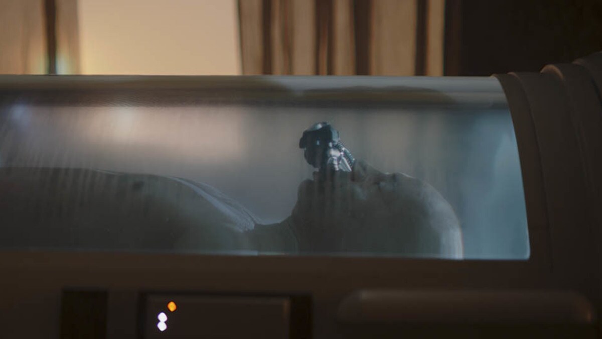 Boba Fett inside a bacta tank