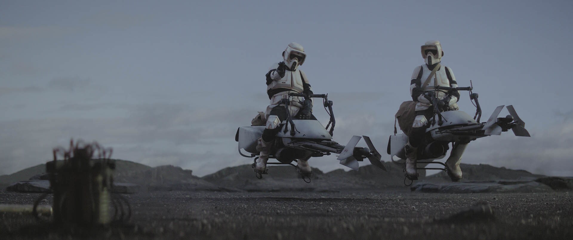 A pair of biker scouts pass the time after snatching the Child, but their banter is interrupted b...