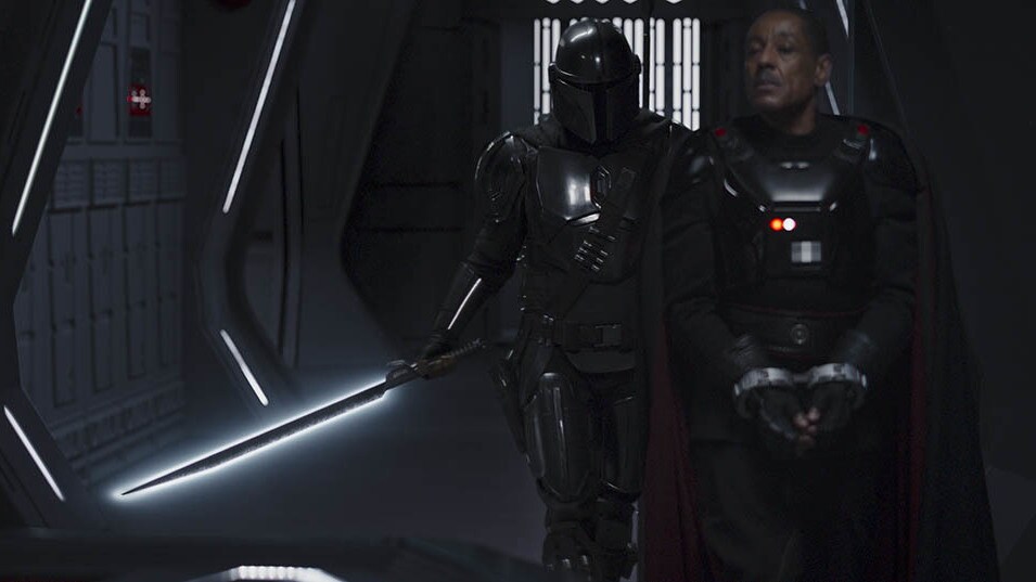 The Mandalorian, carrying the Child and with the Darksaber in hand, brings Gideon to the bridge. ...