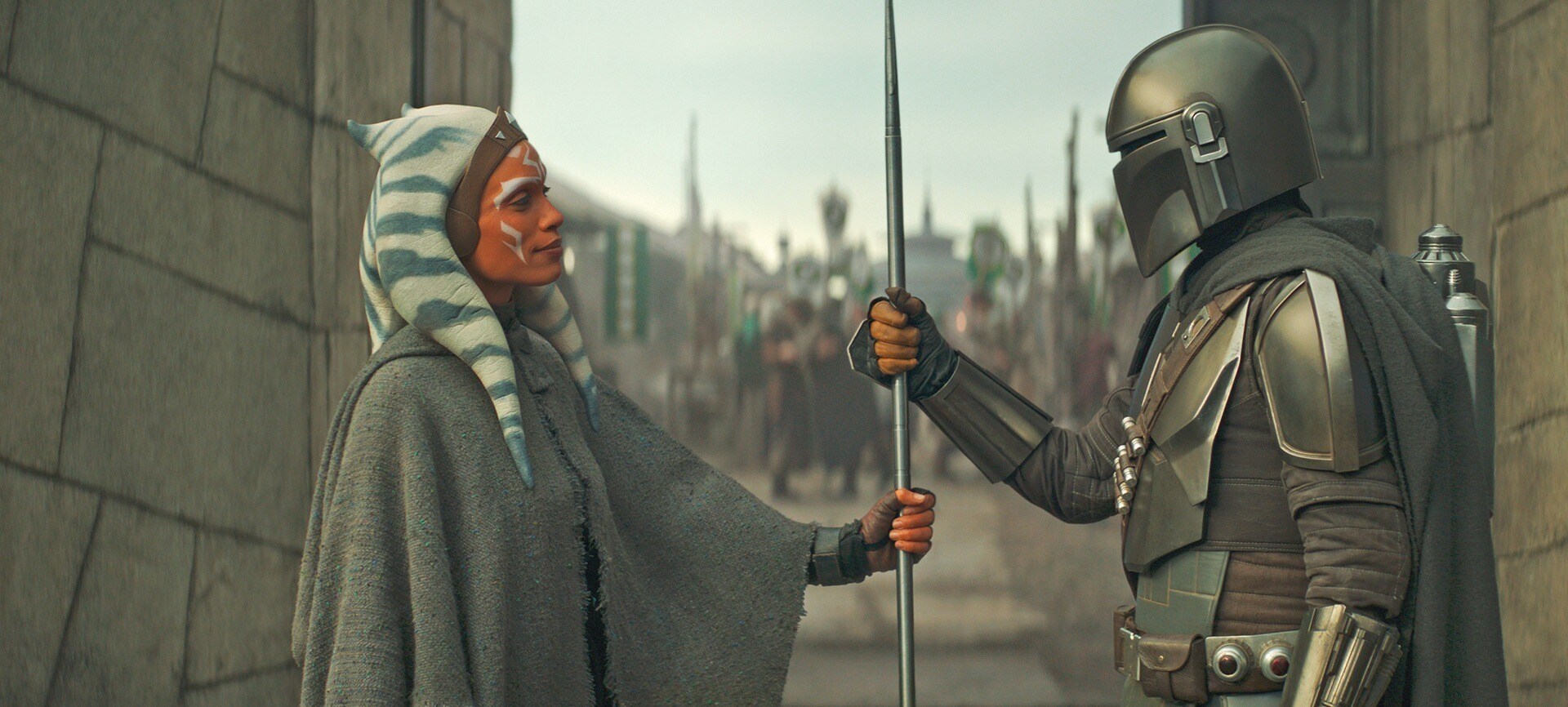 Ahsoka handing the beskar staff to The Mandalorian